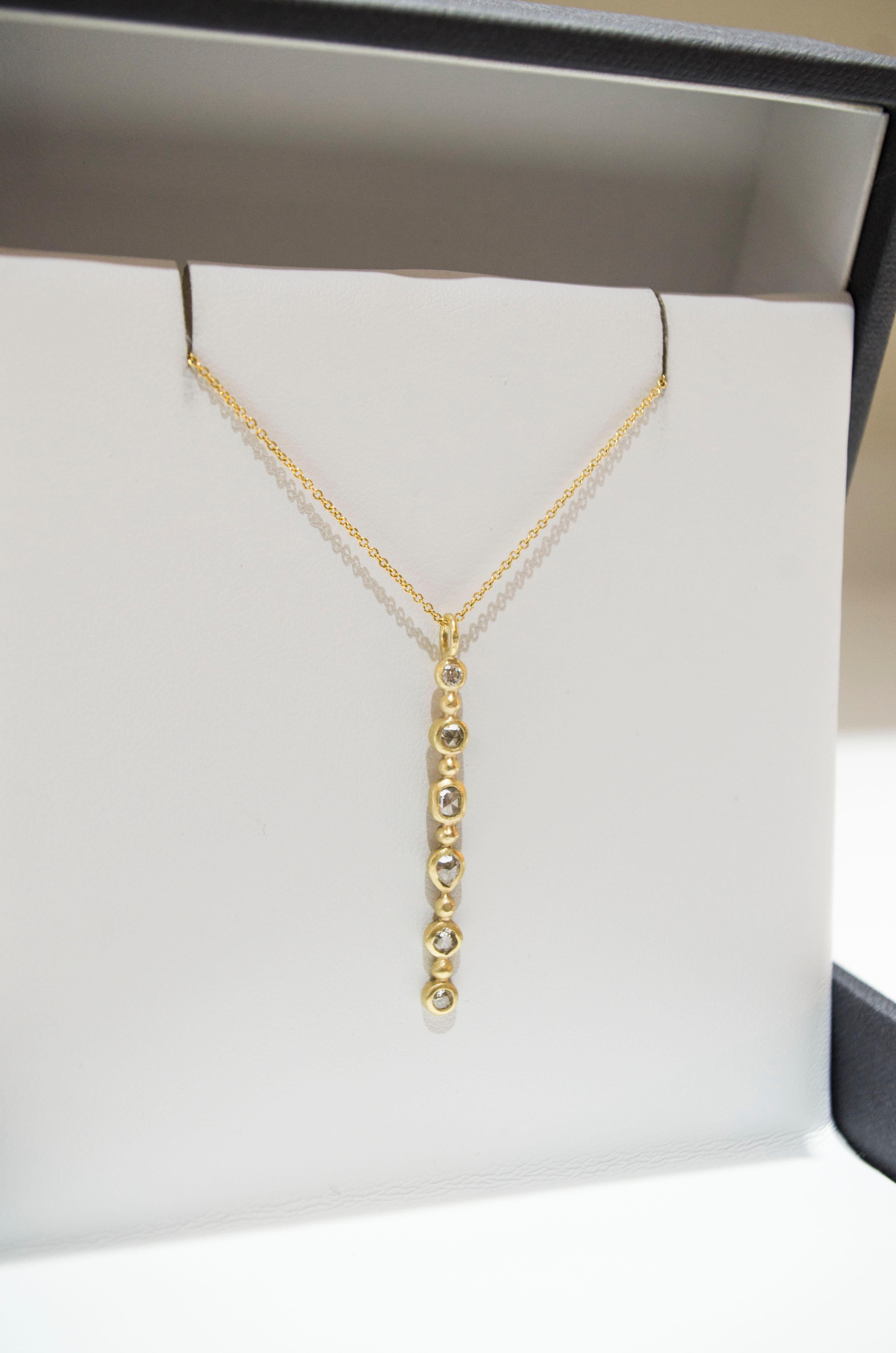 Classic, sophisticated one of a kind diamond bar necklace.  Using Old European Cut diamonds, the pendant is handcrafted in 18k gold with a matte finish.  Take casual chic to the next level! Diamonds:  1.25 Carats twt
Length:  1.5