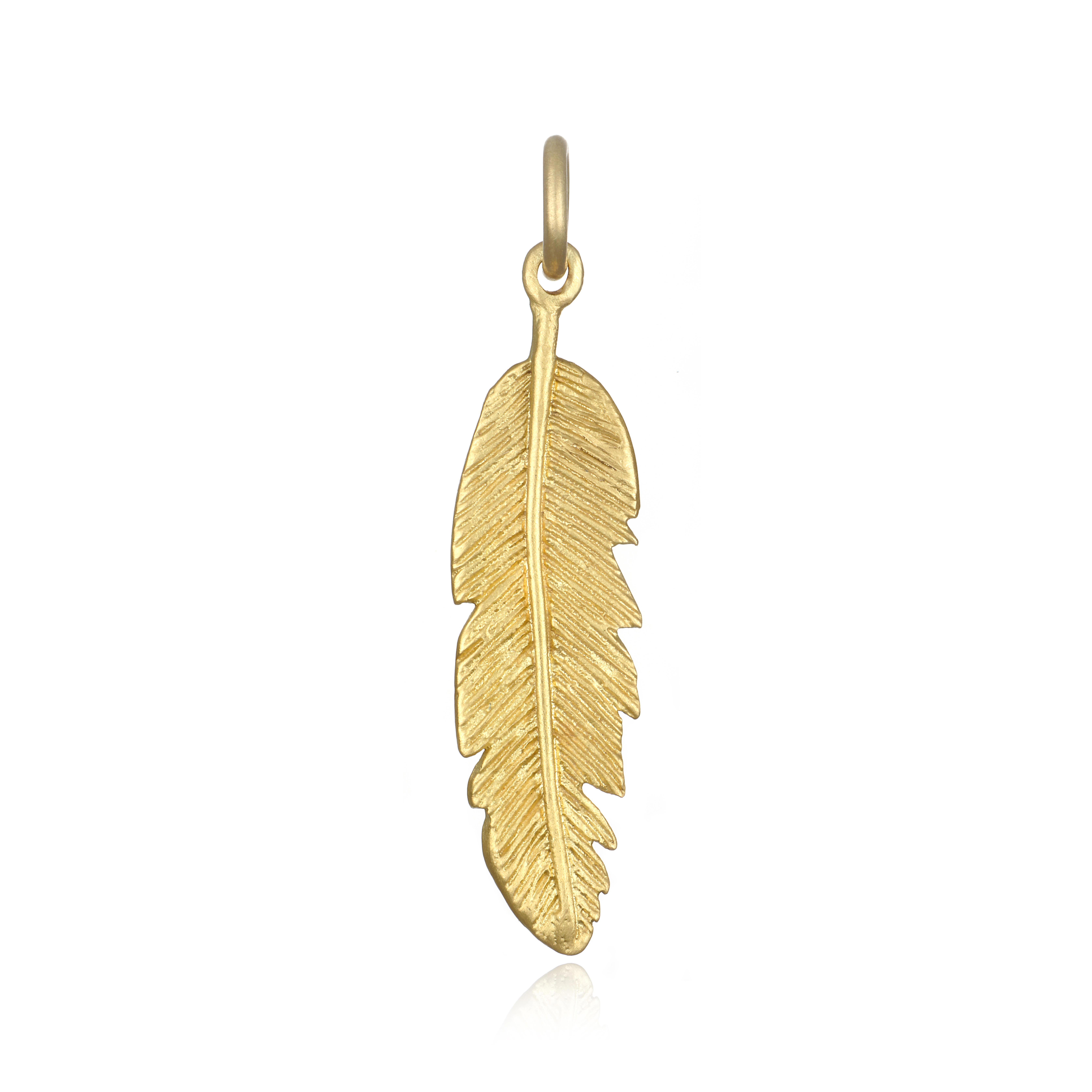 Symbolizing light, trust, and freedom, Faye Kim's feather charm necklace is handcrafted in 18k gold*.
Great worn alone or layered with other pieces. 

*Faye Kim's signature 18k green gold is comprised of 75% pure gold and 25% silver.
Customizable in