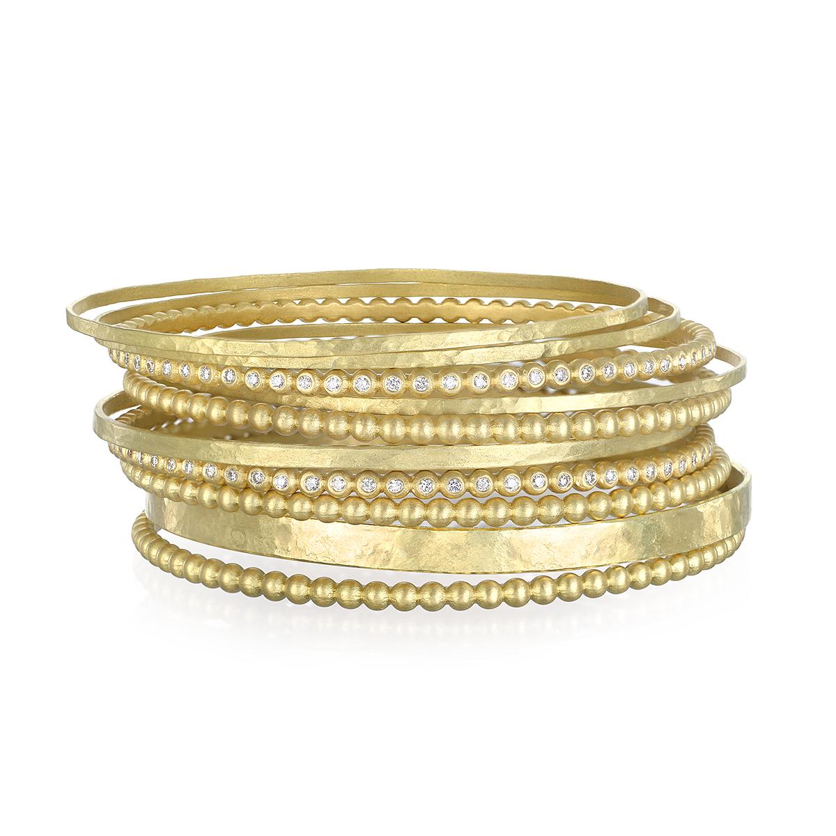 From Faye Kim's signature bangle collection, this flat bangle in 18K* gold is lightly hammered for texture and contrast. Perfect for stacking with other bangles and bracelets!

Bangles are sold individually.

Width 2.5mm 
Diameter 2.5