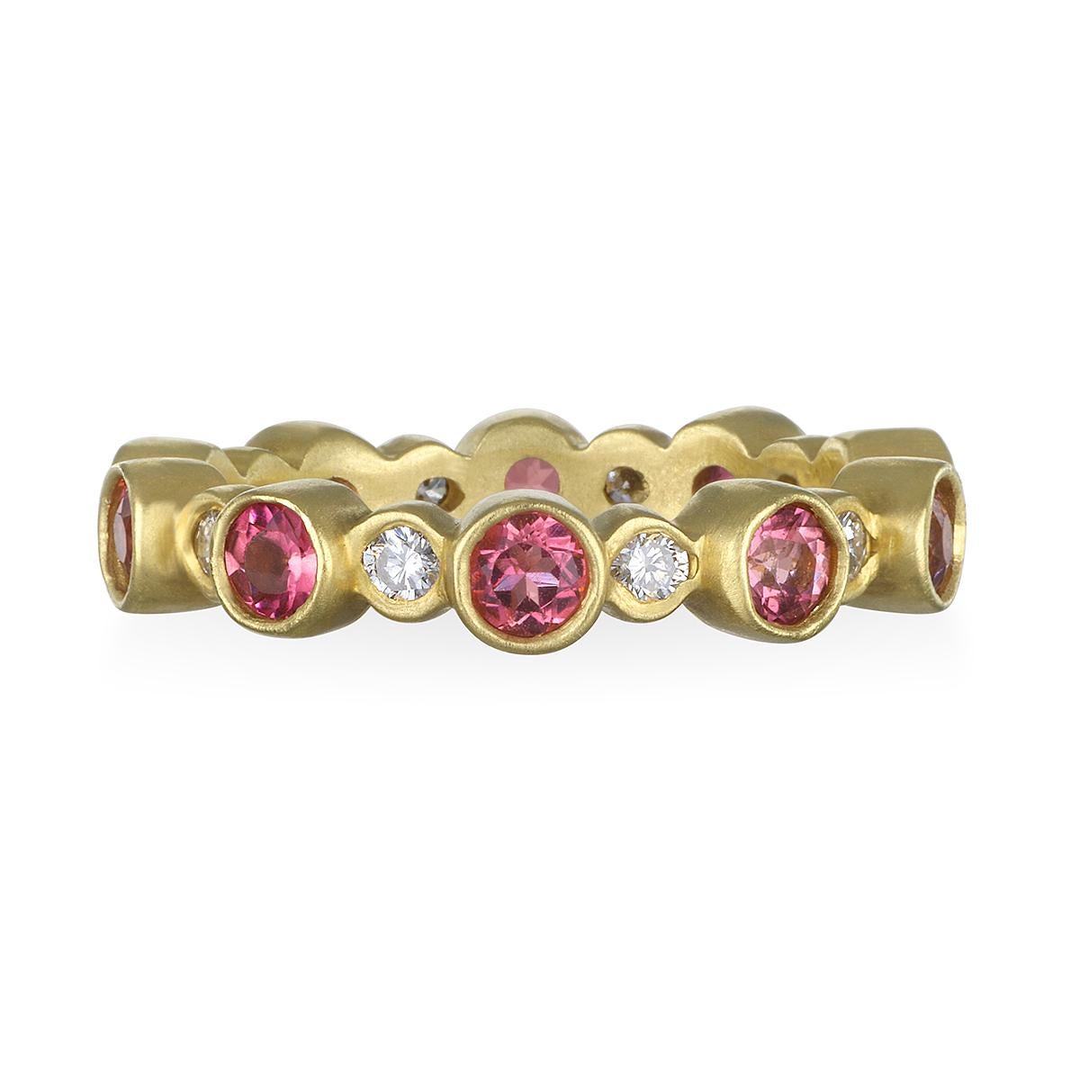 Great for stacking!
Alternating bezel ring with diamonds and green tourmaline. Set in 18k gold with a matte finish, this ring can be worn alone or stacked with other diamond and colored stone bands to create your own unique style. 
Diamonds:  .42