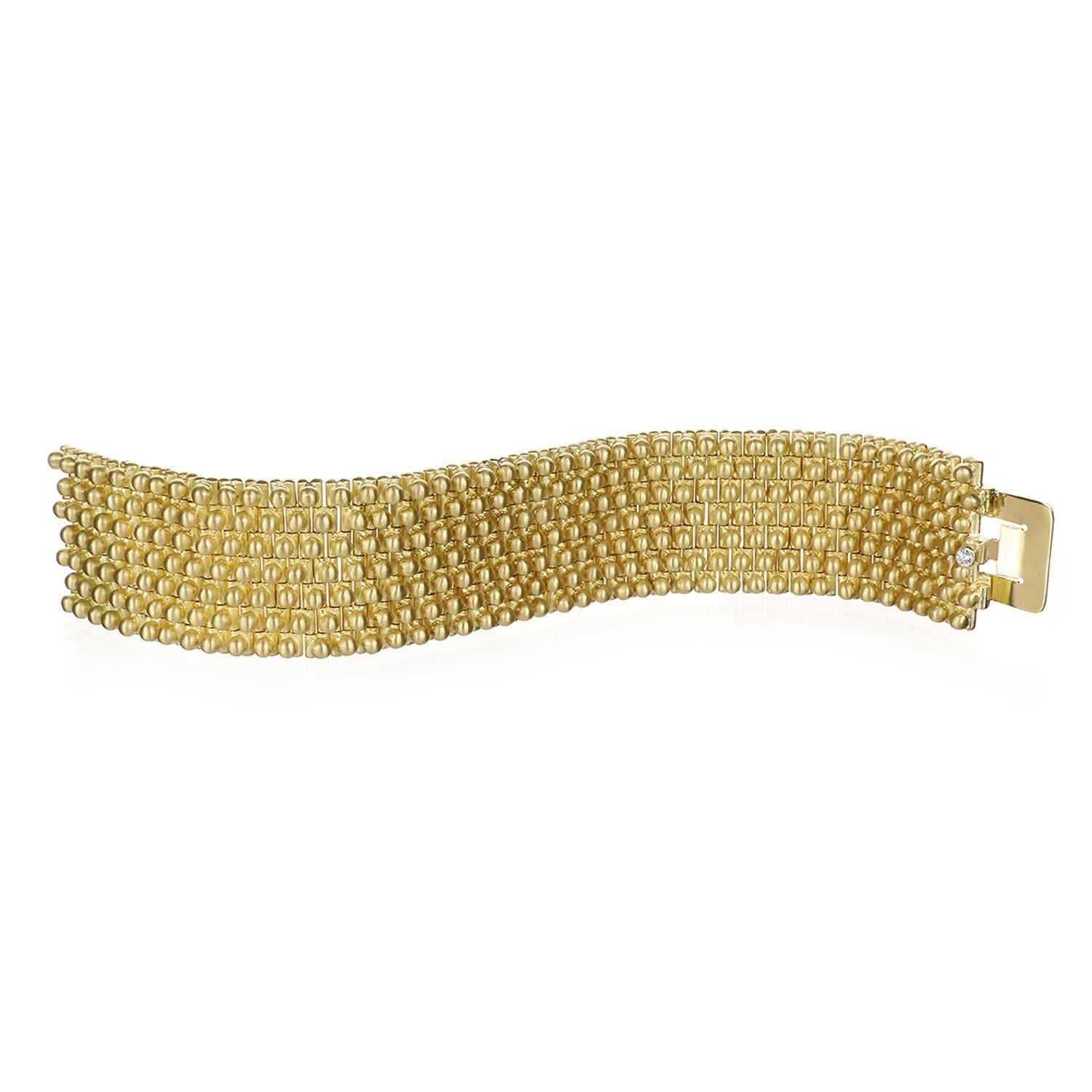 Faye Kim has gone above and beyond in creating this showstopper handmade flexible link cuff bracelet in 18K gold.  The weight of this piece is not to be believed and will always be appreciated by the lucky owner.  The bracelet is perfectly finished