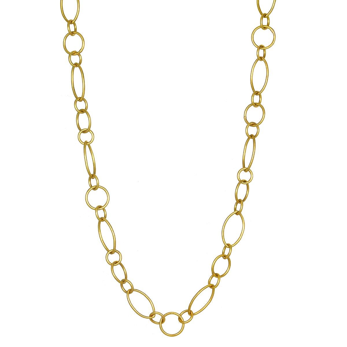 Catena a maglie tonde e marquise in oro 18k fatta a mano

Lunghezza 22