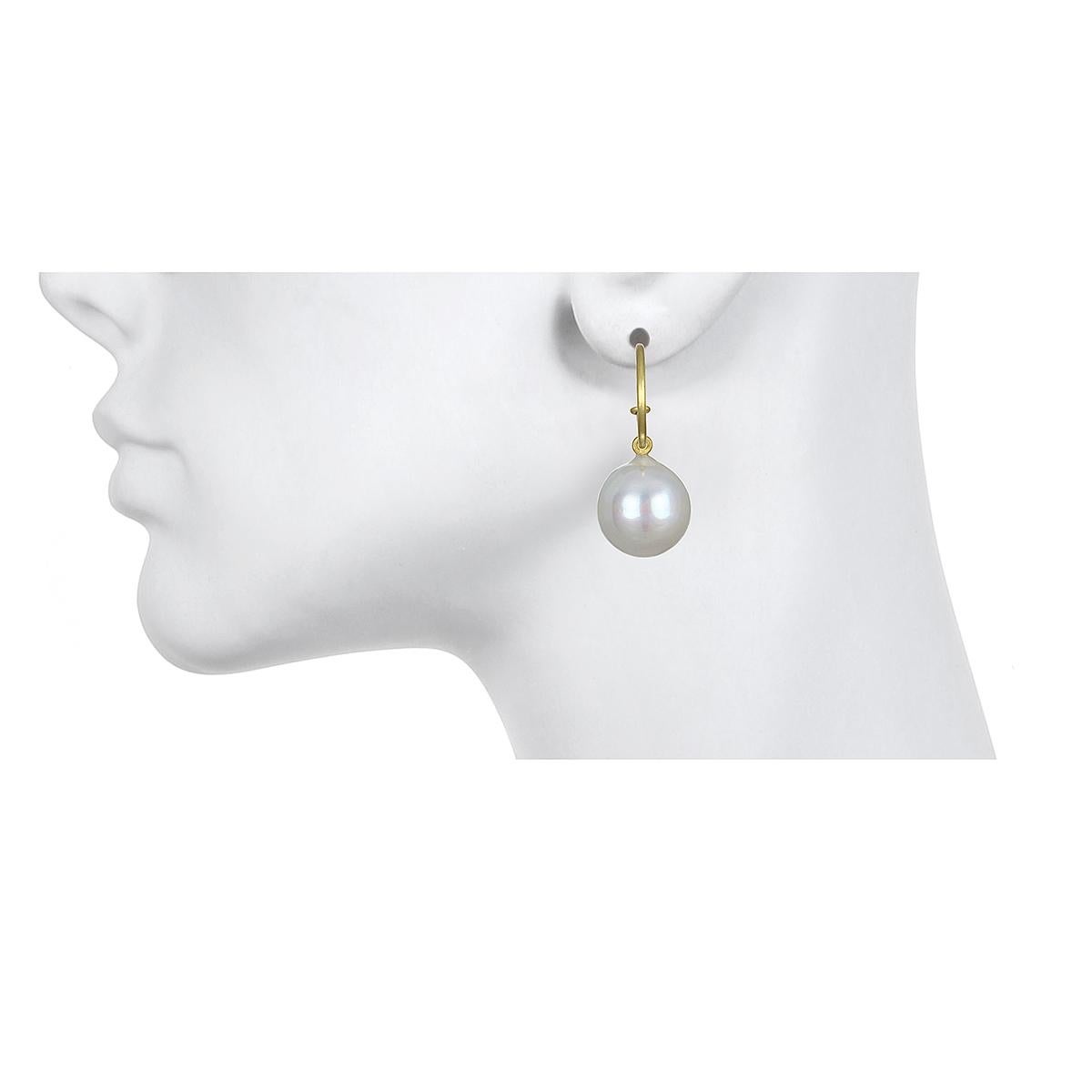 A classic look that is always in style!
Faye Kim's updated version has a smaller hoop with oversized drops to accentuate
the pearls. The white south sea cultured pearls are slightly baroque, very clean with a beautiful luster.
Perfectly casual or