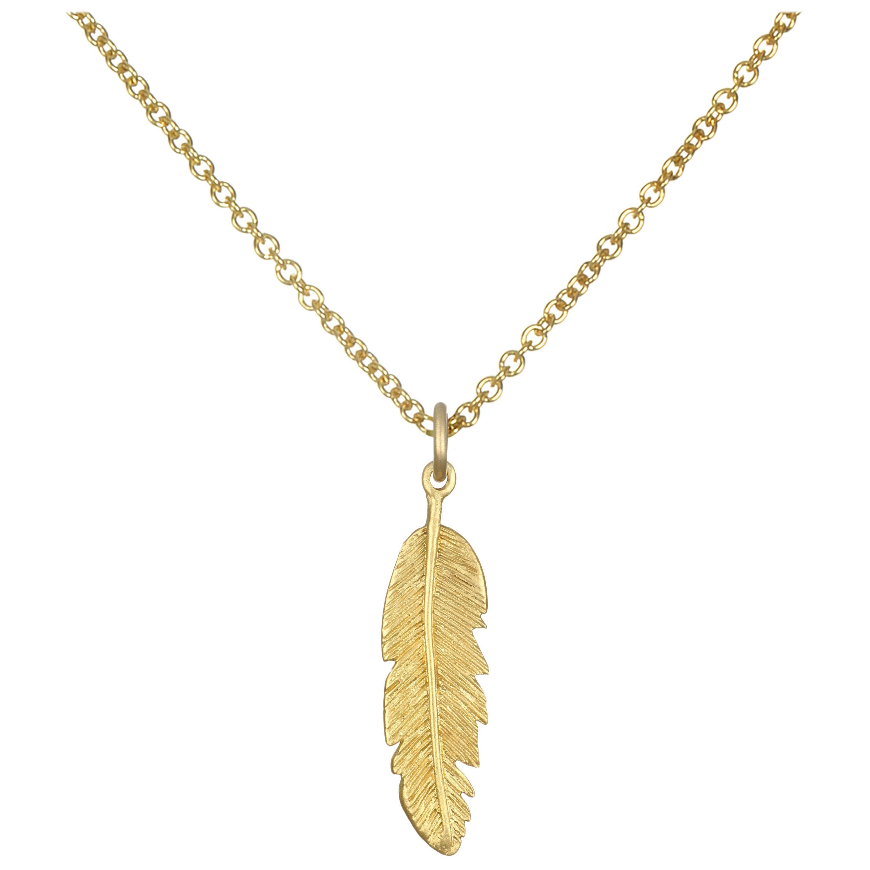 La grande collana di charme con piume di Faye Kim è realizzata a mano in oro 18 carati. Perfetto da indossare da solo o a strati con altri pezzi, venduti separatamente. 

Lunghezza della piuma 30 mm

In questo caso si tratta di una catena con cavo