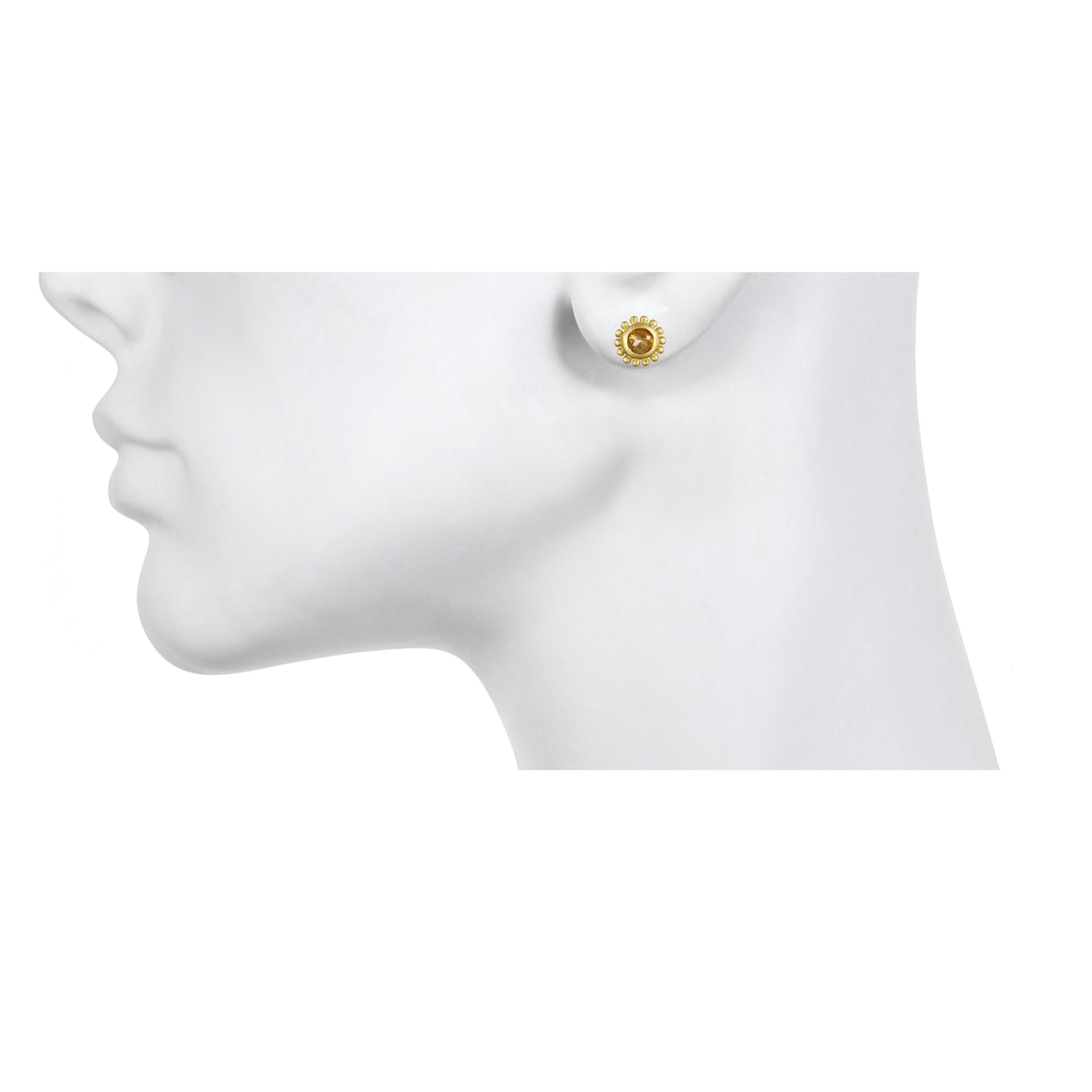 Handcrafted in 18k gold, Faye Kim’s modern design conveys understated elegance and a truly stylish, everyday look. Complete with yellow/green milky diamond centers and granulation detail, these studs have a unique and organic feel.

Milky Diamonds =