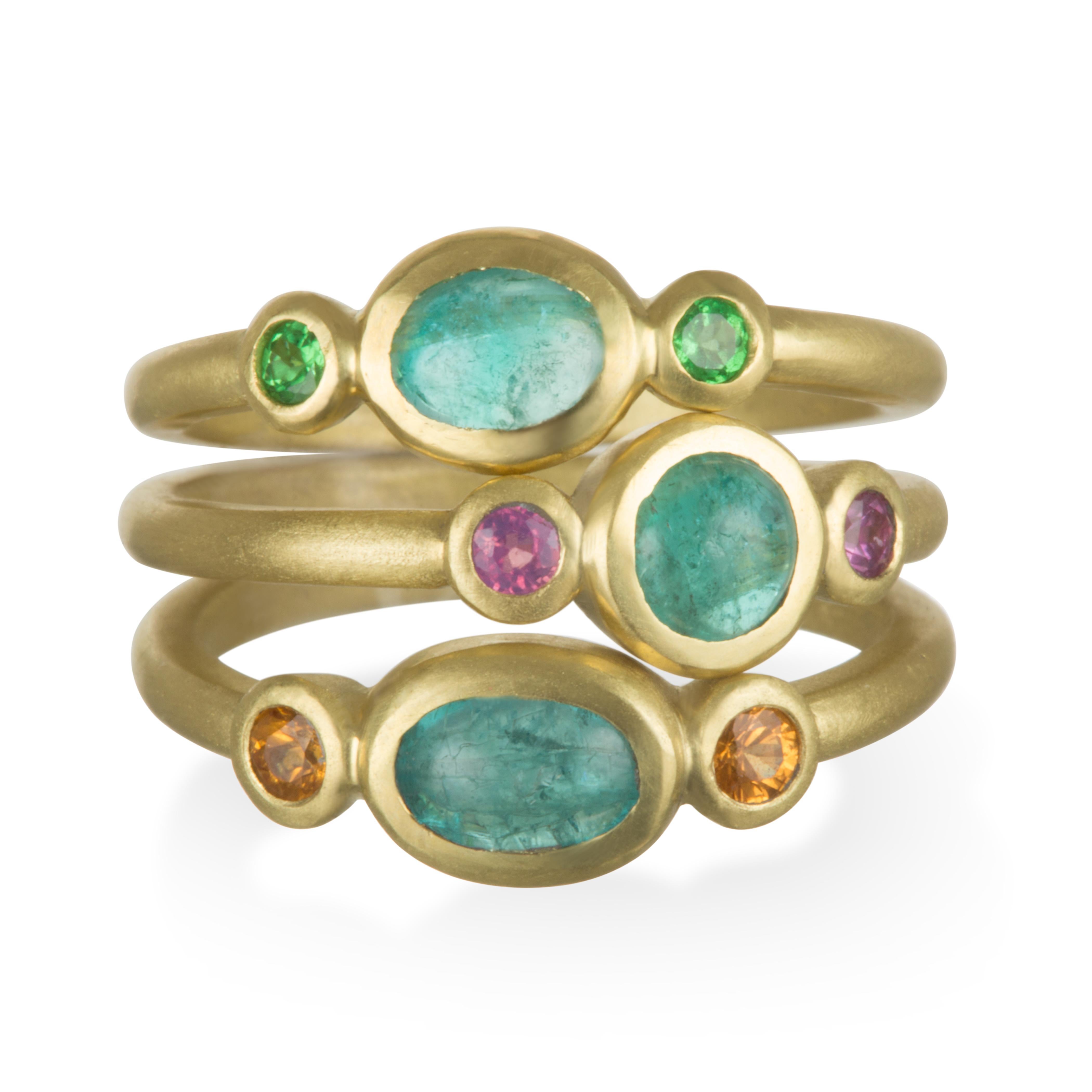 18k Gold Paraiba Tourmaline and Tsavorite Stack Ring.  An explosion of color  - Intense blue-green Paraiba Tourmaline is bezel set with bright green Tsavorite Garnets.
A nod to nature producing one of the most vivid combinations of colors.  Expert