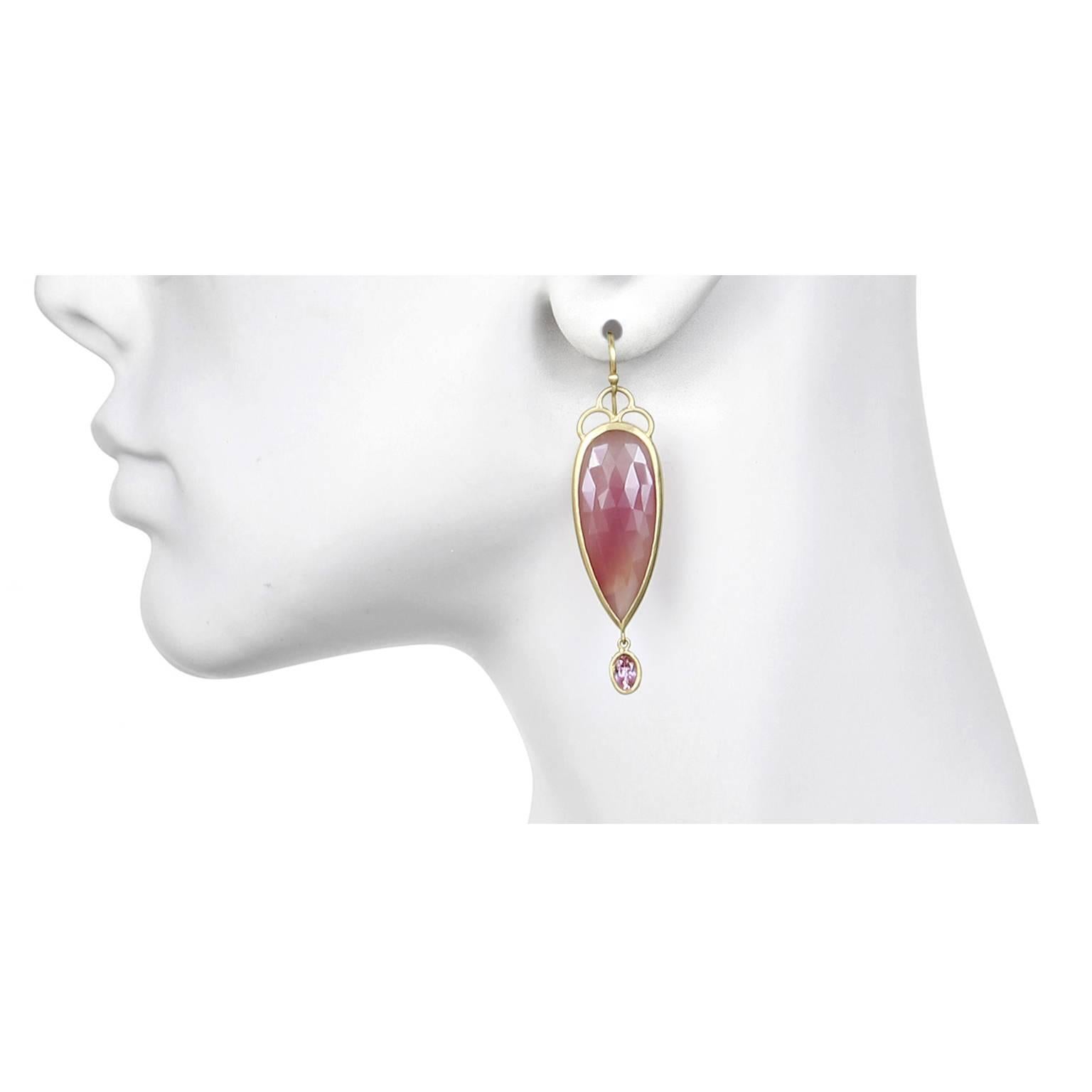 One-of-a-kind, handmade pink sapphire earrings in 18k gold.  The soft color and the long and lean shape of the tear drop Sapphires make up these earrings that are truly unique. Scallop detail and movement of the faceted oval Imperial Topaz drops add