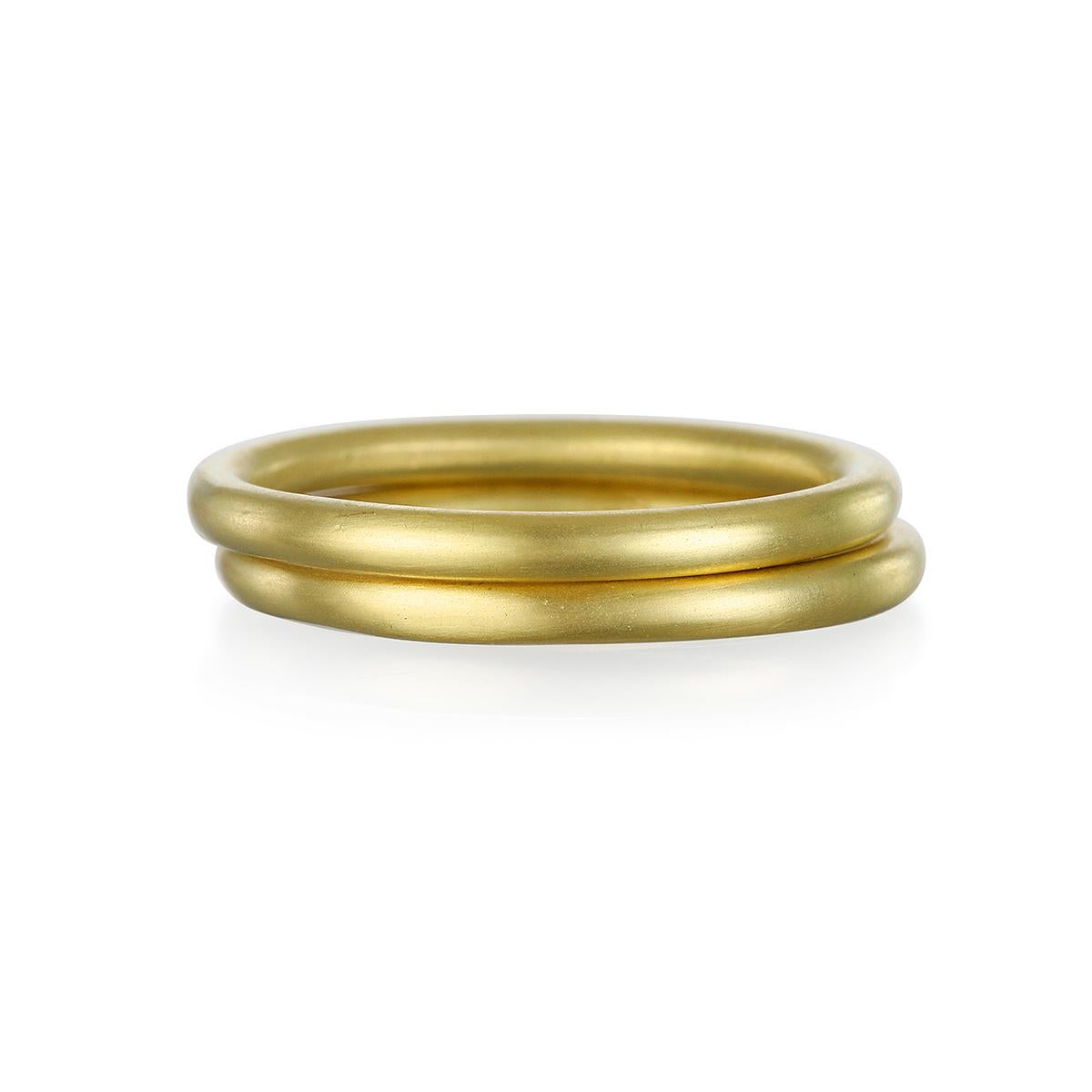 Handmade in 18k gold* with a matte finish, Faye Kim's 2mm round band is classic and versatile and a perennial favorite. Wear alone or stack to create your own unique style.

*In Faye Kim's signature 18k green gold, an alloy comprising 75% pure gold