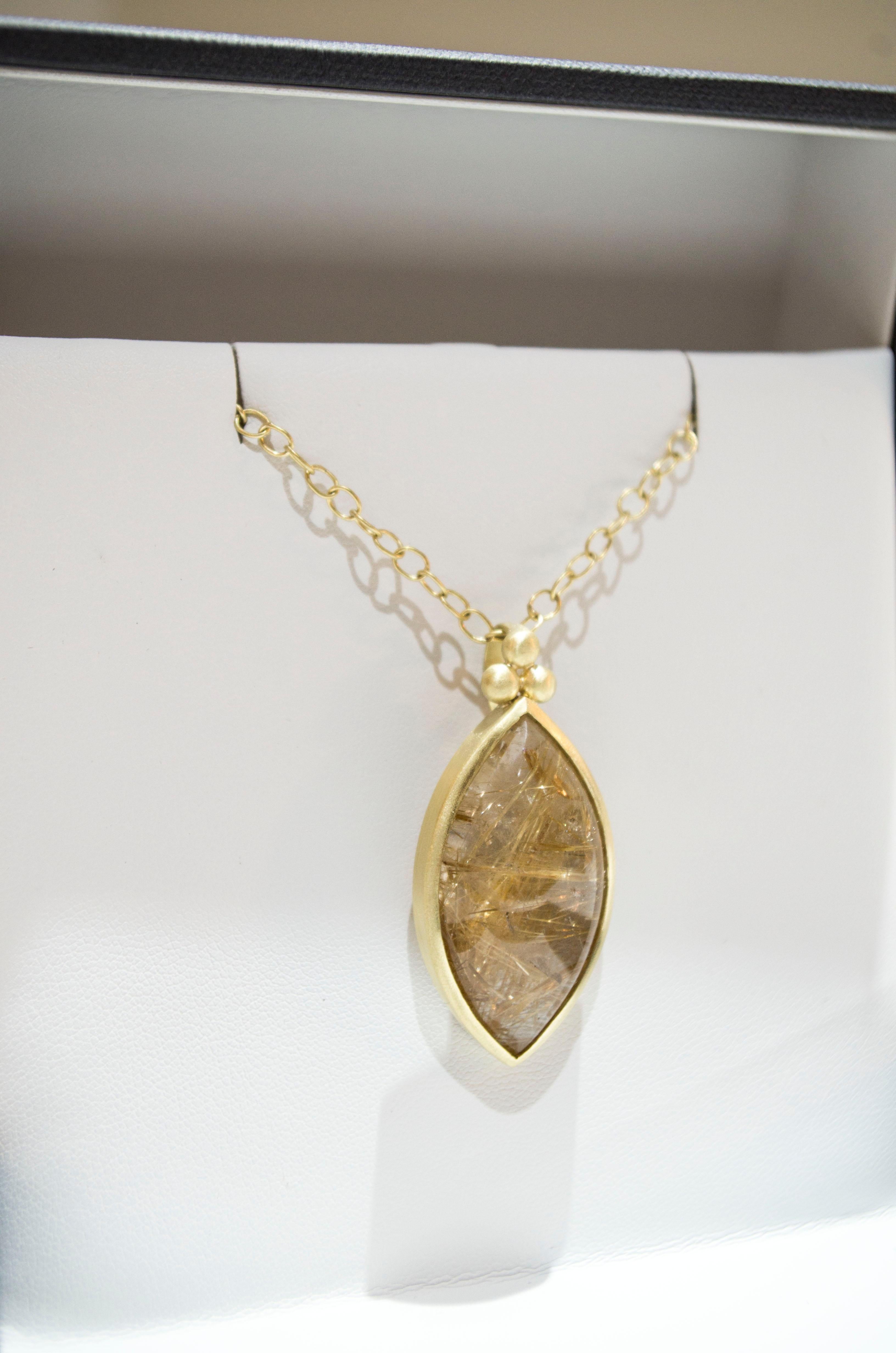 Unique and One of a Kind Rutilated Quartz Pendant on Medium Oval Link Chain. 
Handcrafted in 18k gold with triple granulation bead detail, the oversized Marquise shape and the natural inclusions of the rutile needles are enhanced by the matte gold
