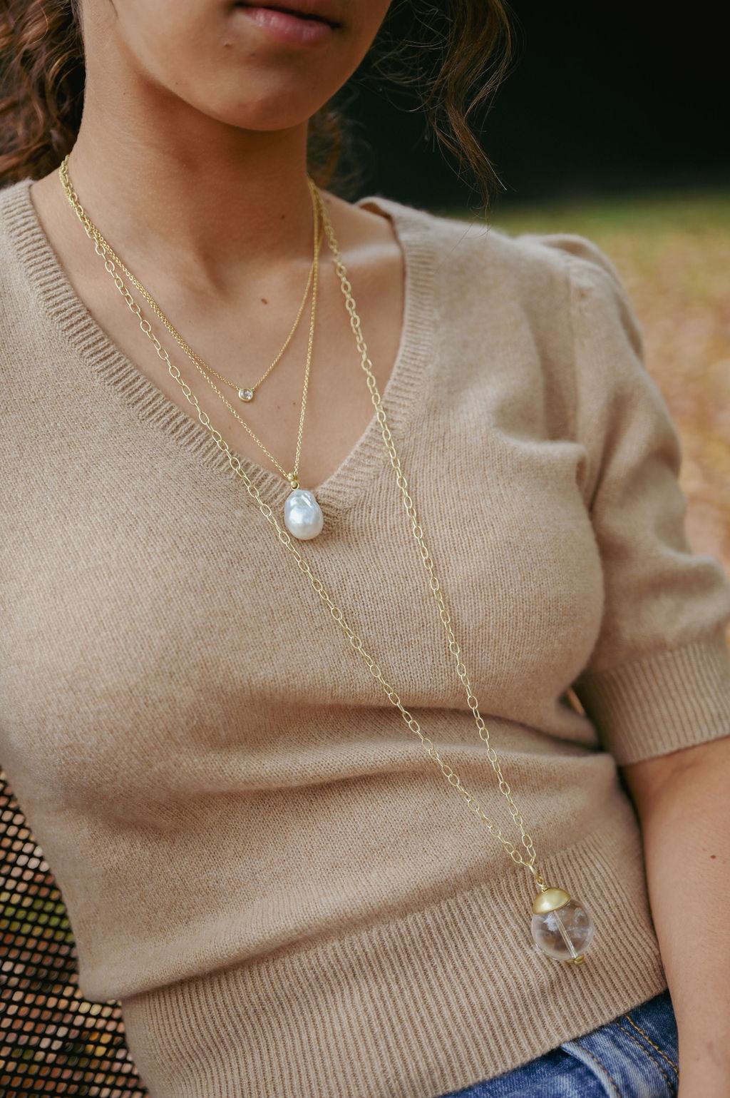 Simply beautiful, Faye Kim's White South Sea Baroque Pearl Pendant is finished with an 18k Gold* Granulation Bail on an adjustable Cable Chain. 
 *Faye Kim's signature green gold is comprised of 75% pure gold and 25% silver.
Pendant 16 x 22 mm
Chain