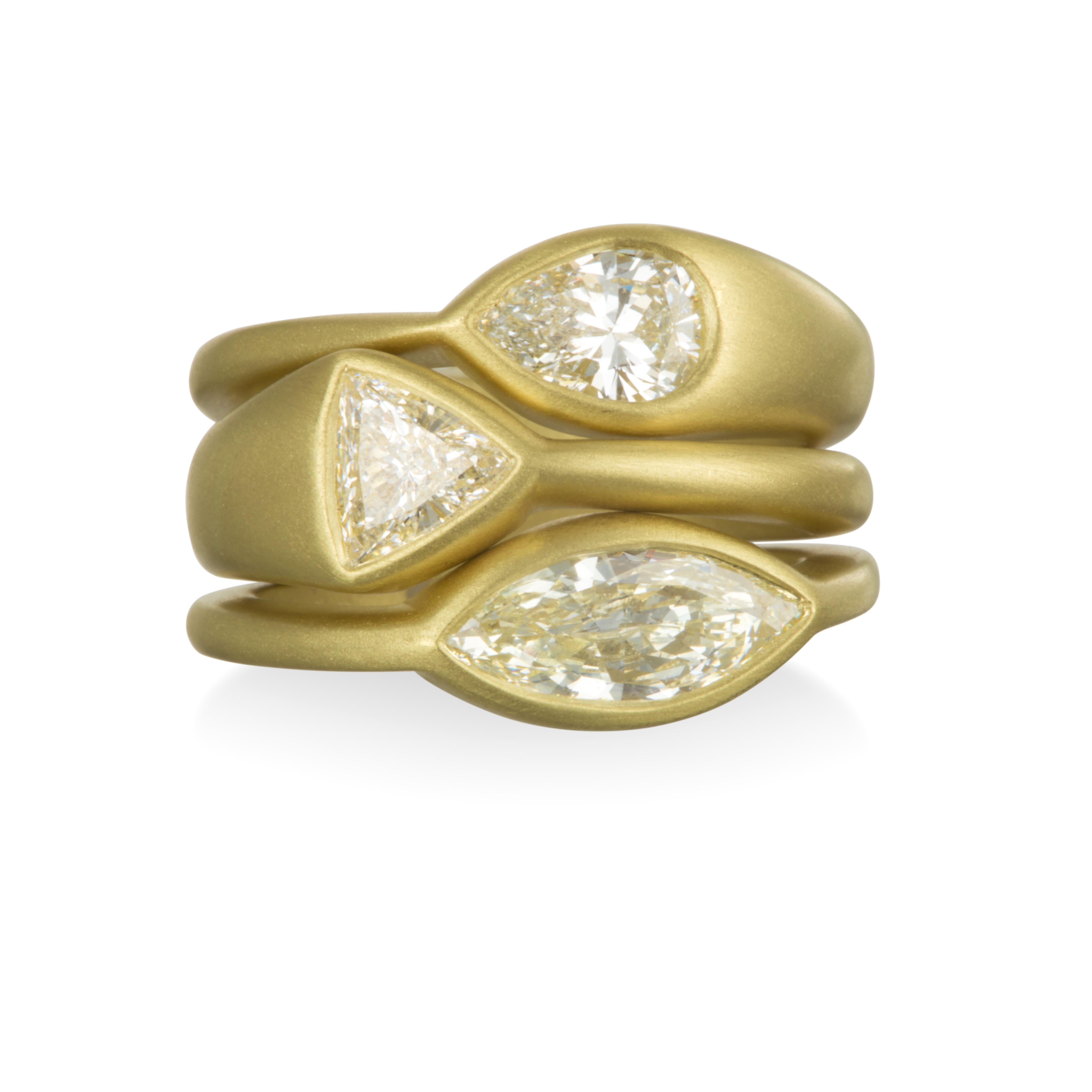 Make an impact with this exquisite modern trillion cut diamond ring. Perfect for the modern bride or great for stacking.  Express your individuality with an original design. 
Handcrafted in 18k gold with a unique bezel setting highlighting the