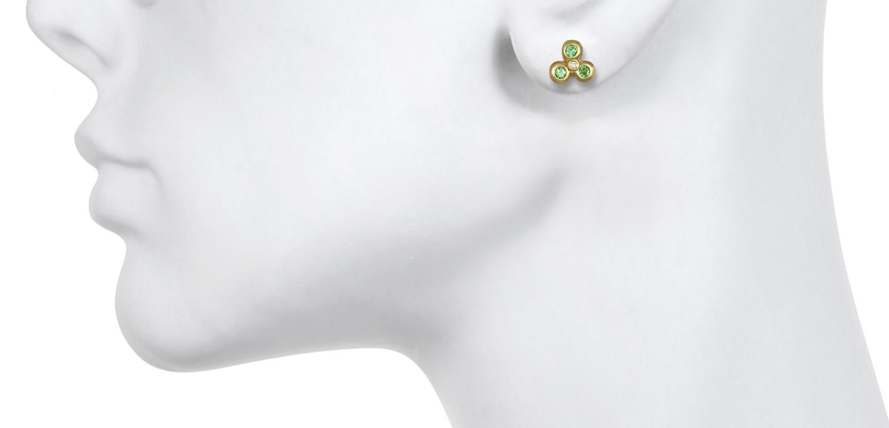 Faye Kim 18K Green Gold Stud Earrings set with Green Tsavorite Gemstones and White Diamonds.
Diameter .312