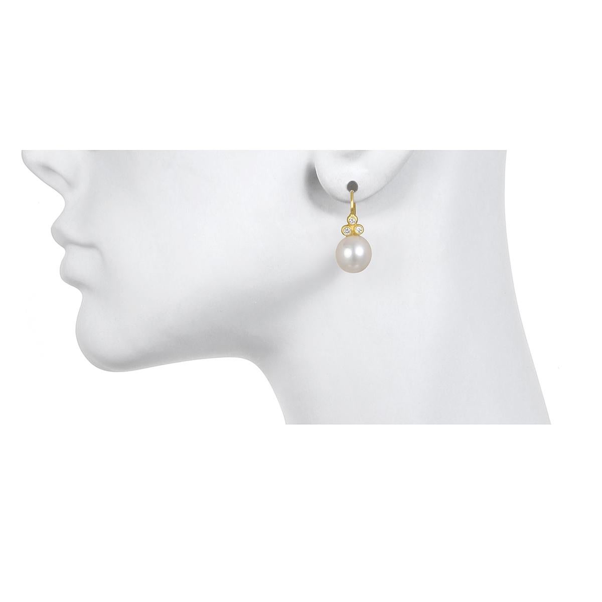 Beautiful triple white diamonds are bezel set in 18K* gold and paired with lustrous white freshwater pearls on French ear wires to create modern-day classic drop earrings.  
Casual or corporate, the clean design is flattering and simply