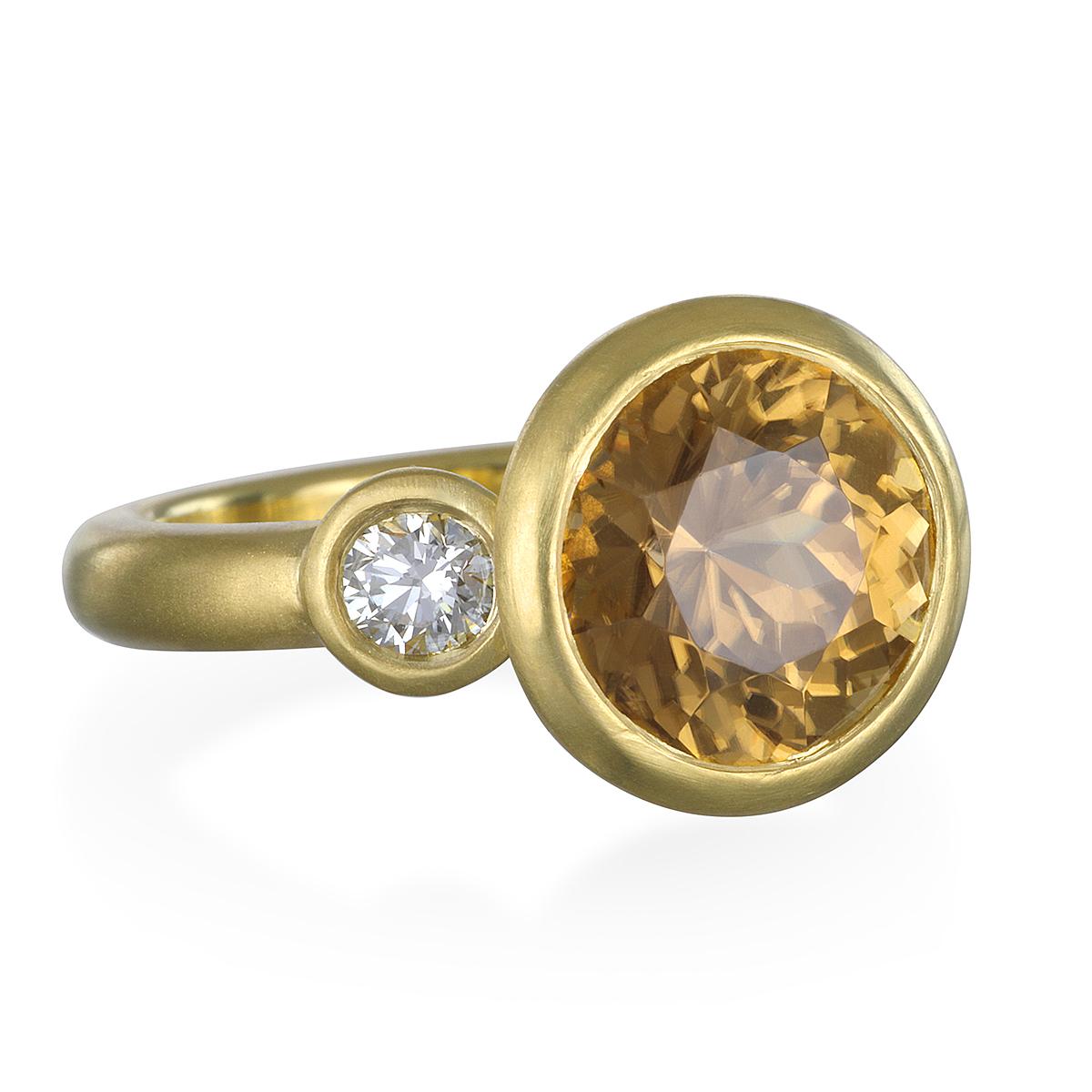 One of a kind and unique.
Zircon is a colorful gem with high refraction and fire. Evident in this Champagne-hued stone, set in 18k gold with bright, white diamonds. The center stone has incredible fire and sparkle, highlighted further by the bright