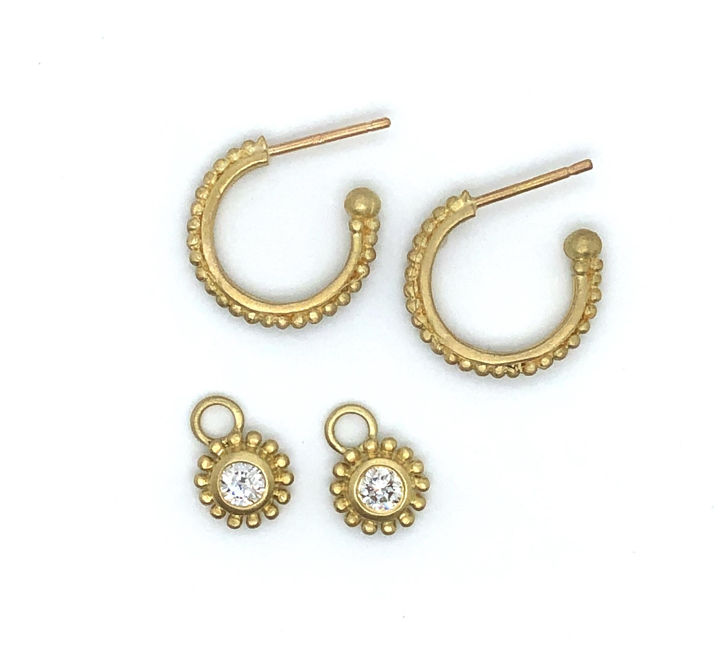 Faye Kim's 18 karat gold hoops with posts offer a twist on the classic pair of gold hoops; granulation detail adds texture and interest. The diamond drops add sparkle and versatility.  Great for daily wear, with or without the drops.

Hoops .5