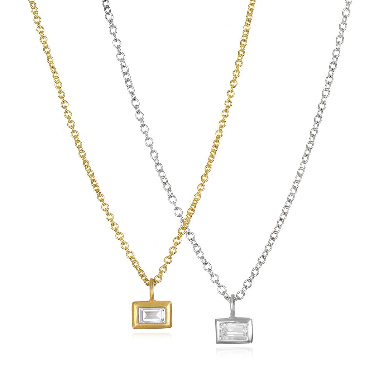 Faye Kim's 18k White Gold Diamond Baguette Drop Necklace with a bezel setting is a simple, classic design.
A little twist on the classic station necklace, the pendant design allows for movement. Whether your style is traditional or contemporary,