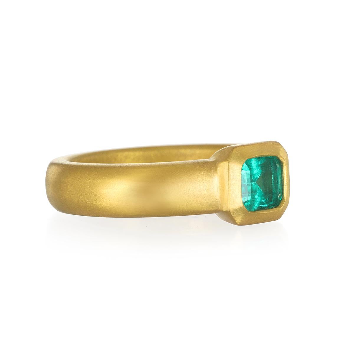 Through time, the emerald has been considered a symbol of truth and love. Here, Faye Kim has created this striking 22 Karat Gold Emerald Bezel Ring, ideal as an engagement ring, statement ring, or for layering and stacking with other rings.

Emerald