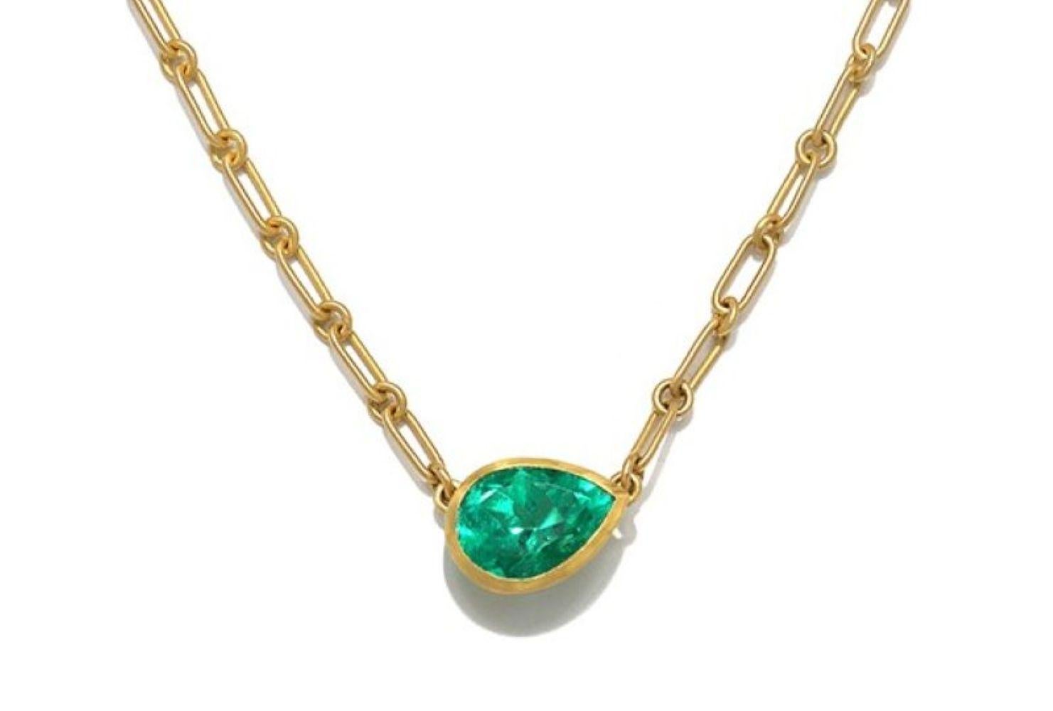 A striking study in simplicity and rich color, this pear-shaped Colombian emerald pendant is set in Faye Kim’s signature warm, matte 22 karat gold. The emerald’s saturated green hue is amplified by the clean, sculptural bezel, creating a piece that