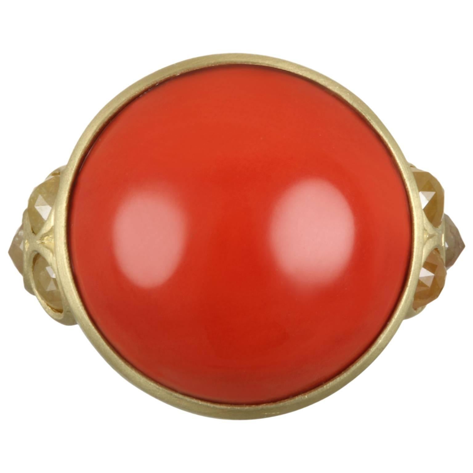Faye Kim's 18k gold fiery red Coral ring touches all of your senses.  Beautifully handcrafted and accented with triple raw diamond granulation detail. One of a kind.
Coral:  17MM
Size 7.

Made in the USA