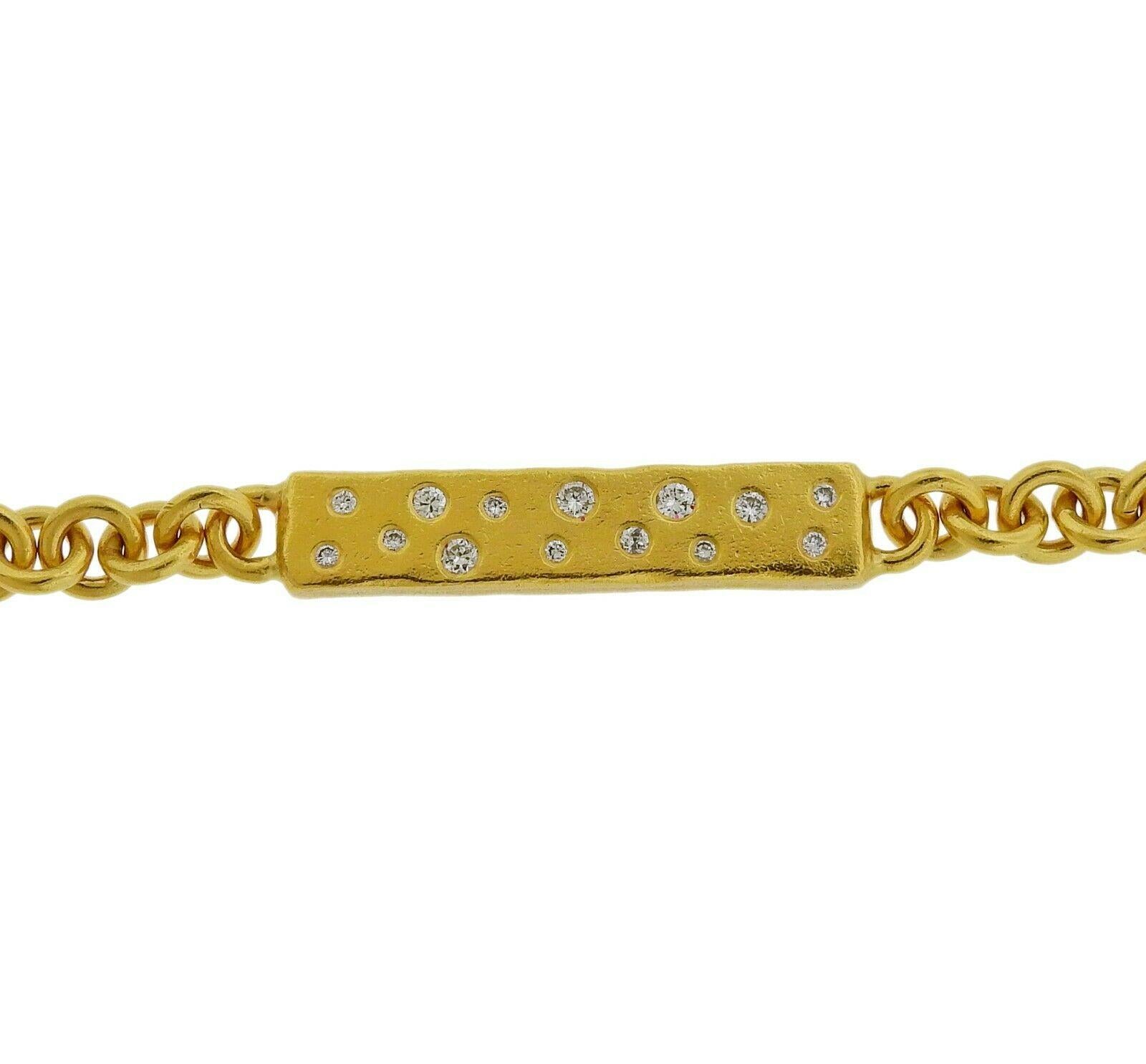 22k yellow gold tag bracelet by Faye Kim, adorned with approx. 1 carat in SI1/H diamonds. Bracelet is 7