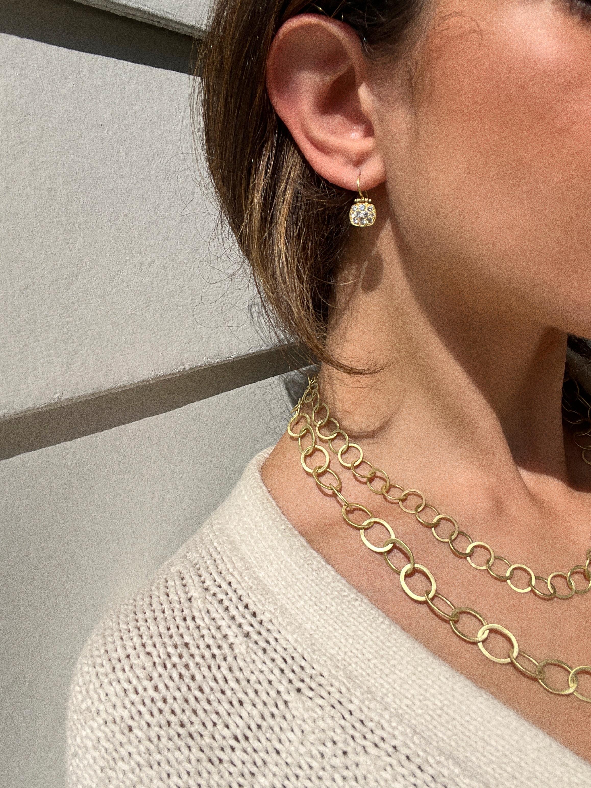 The hinge movement enhances the bright sparkle of the micro pave diamonds on these earrings. Handcrafted in 18 karat gold, Faye Kim's signature chiclet shape is aesthetically pleasing and very flattering. The perfect diamond drop earring! French ear