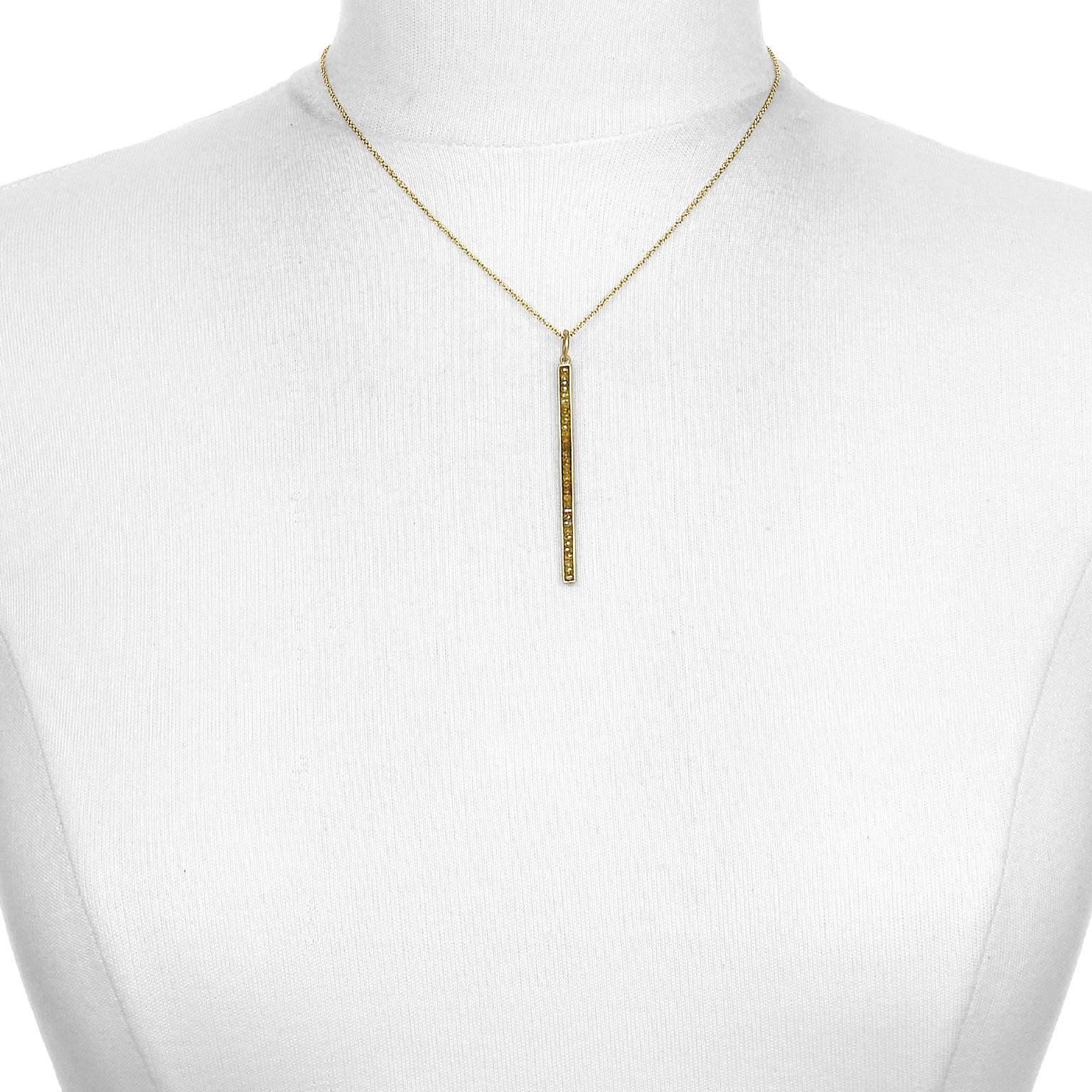 Slick and linear are the thoughts that come to mind when sporting this elegant 18k gold and diamond bar pendant.  The taupe, olive green hues are unique and sparkly.  To be worn on its own or layered with it being the perfect focal point.  Perfect