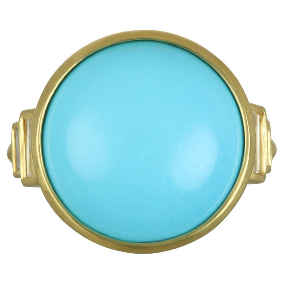 The classic combination of Arizona Sleeping Beauty Turquoise and gold in Faye Kim's 18k green gold* ring is timeless.  Embellished with diamond baguettes and bezel set in a clean, modern style, the turquoise ring is eye-catching and beguiling - a