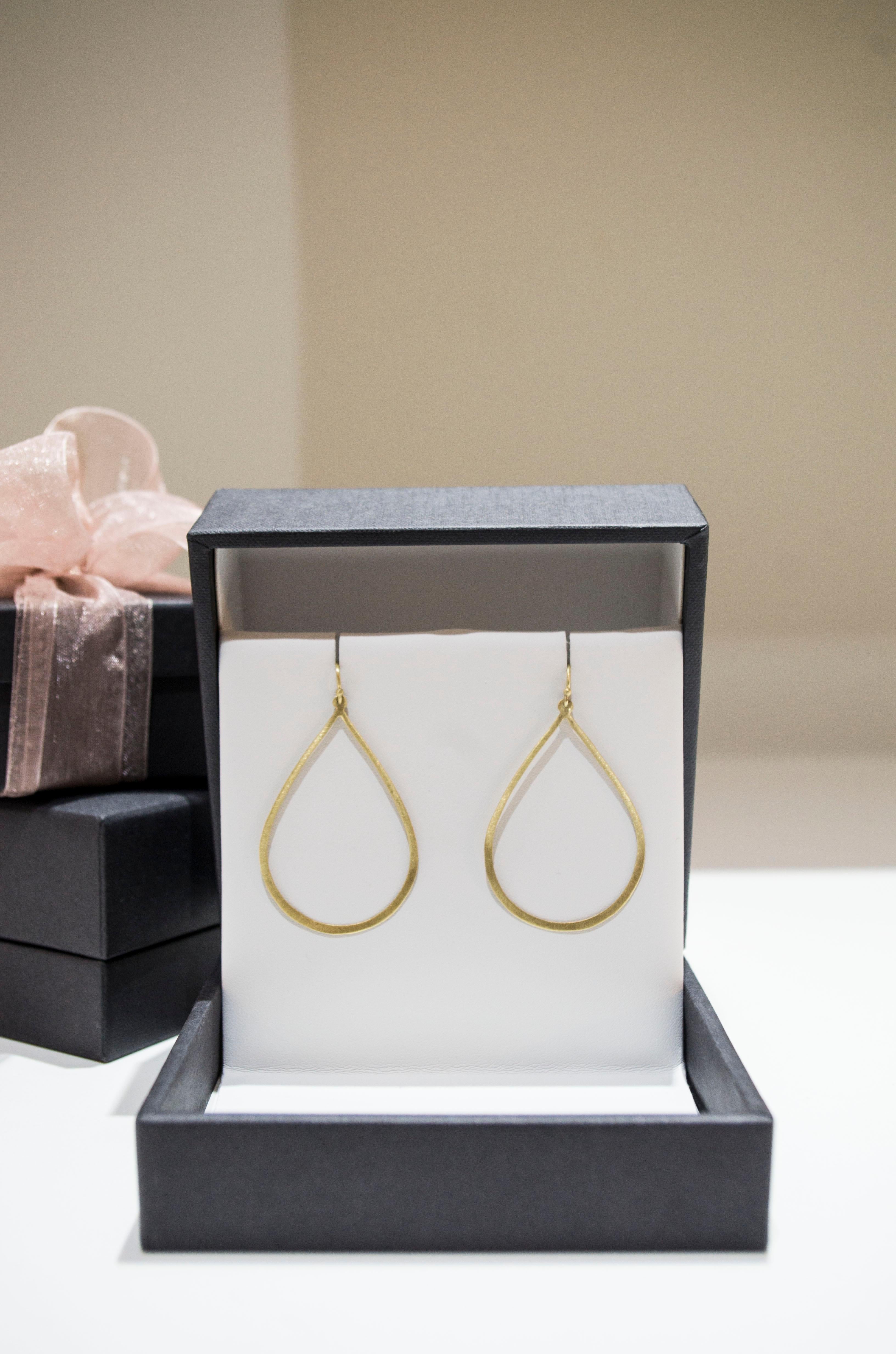 Handmade in 18k gold, the planished surface creates dimension and gives substance to these lightweight, super comfortable and easy to wear teardrop earrings.  

Length:  1.5