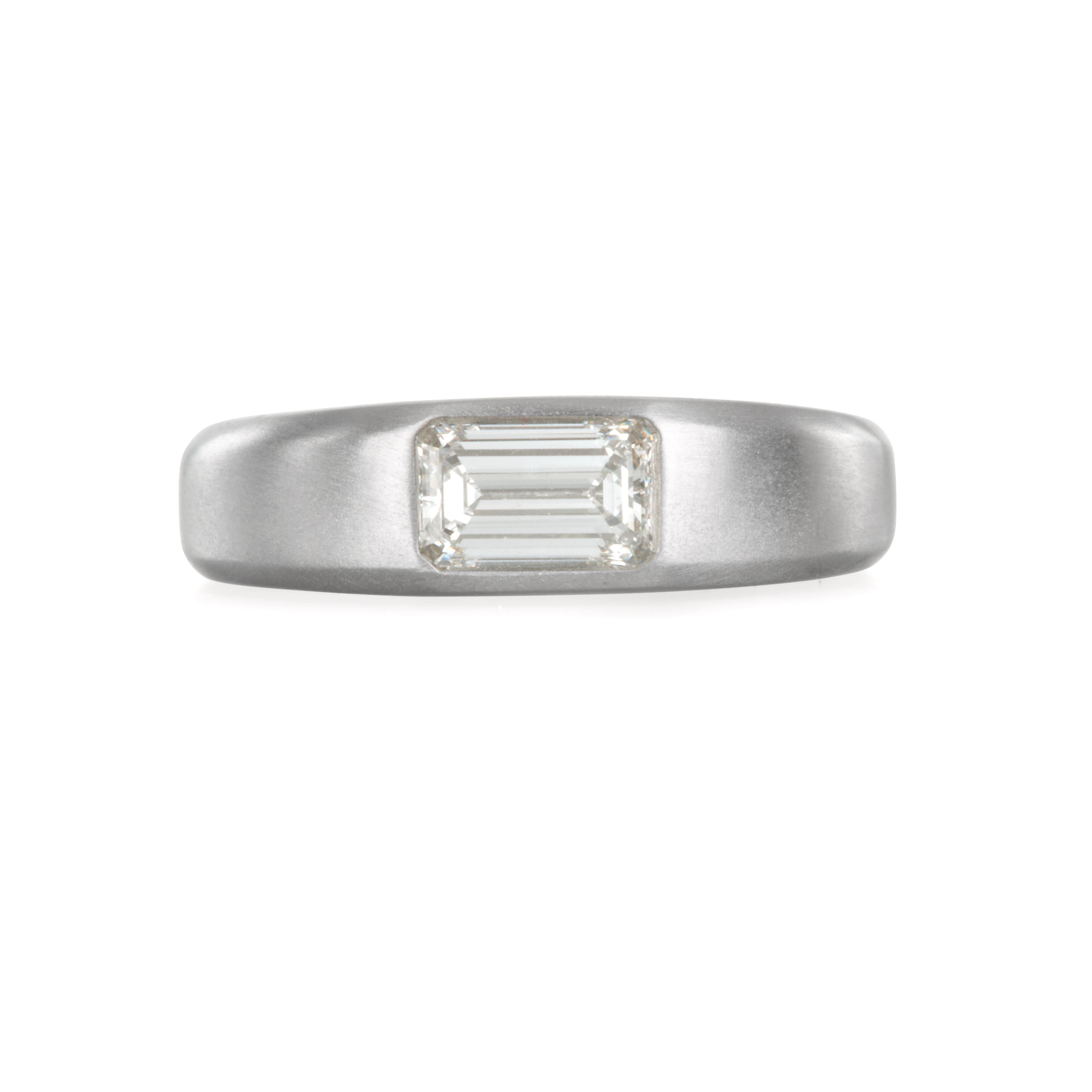 The ultimate statement of luxury and style.  Platinum modern engagement ring or stack ring featuring the crisp and clean lines of an emerald cut diamond.  Forge your own style and never settle for average.  Matte-finished.  

Size 6.25
Diamond =
