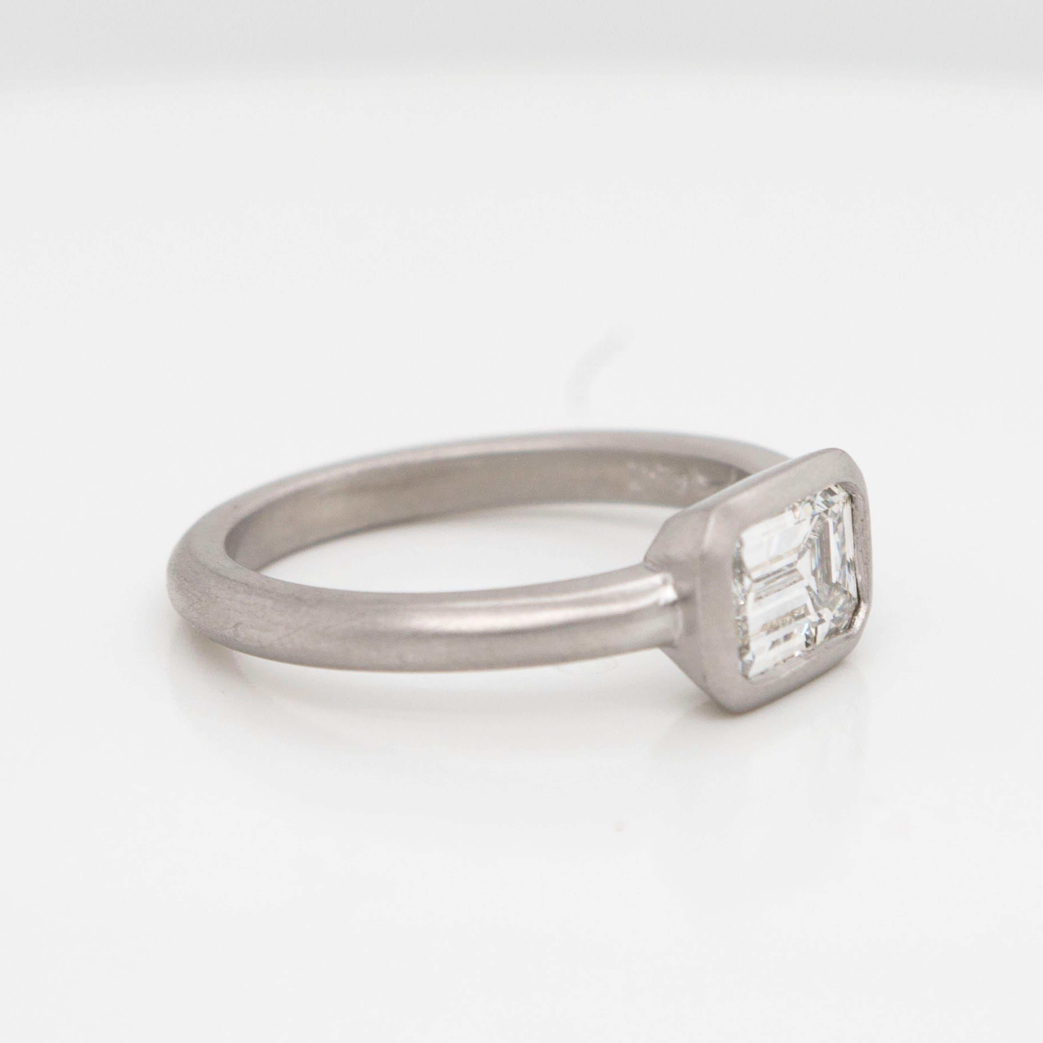 Whether worn as an engagement ring or a stack ring, Faye Kim's Emerald cut diamond ring in Platinum is handcrafted with a beautiful matte finish for a clean, contemporary feel.
Size 7
Diamond - 1.04 Carats
GIA Certified - I Color, VS1 Quality