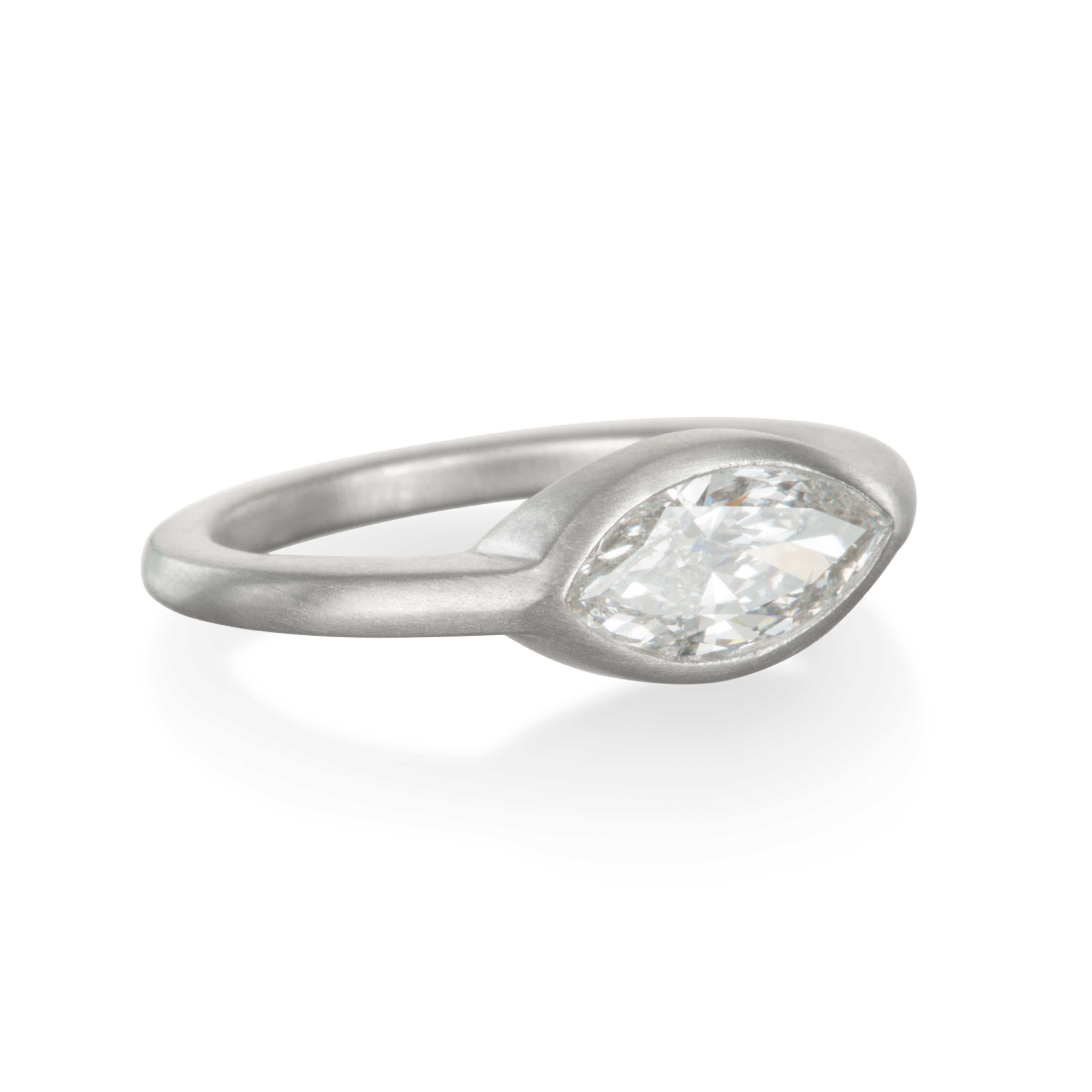 The ultimate statement of boldness and style.  Platinum modern engagement ring or stack ring featuring the chic and clean lines of a marquise cut diamond.  Forge your own style and never settle for average.  Matte finished.  

Size 6.75