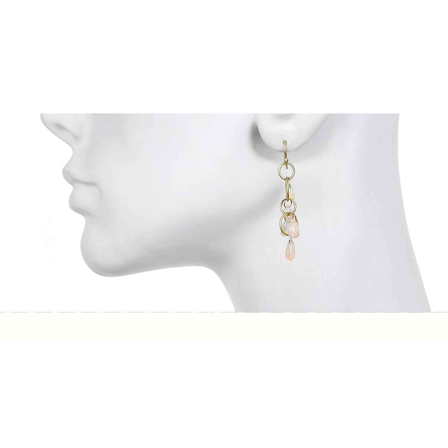 A perennial favorite!  Earrings in 18k gold featuring planished rings and opal briolettes. Fun, versatile, and lightweight, these earrings with their magical iridescent glow can easily shift from workweek to weekend in a snap.

