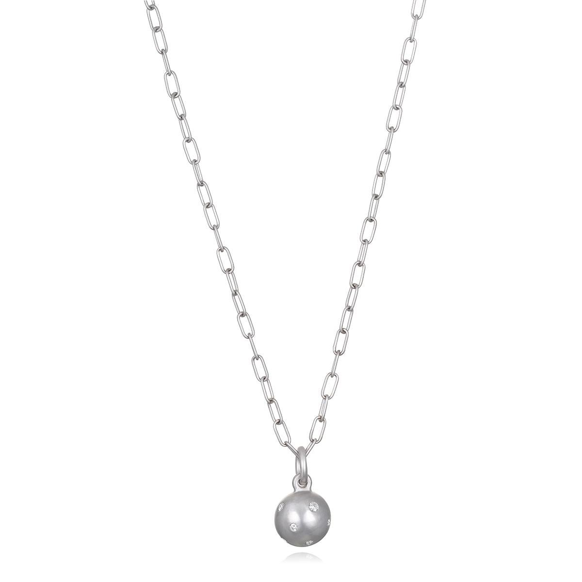 Faye Kim's Platinum Burnished Diamond Ball Charm, with its solid platinum construction and diamond-studded surface, offers the perfect weight and just the right amount of shine and sparkle. Worn alone or layered with other necklaces and charms, this