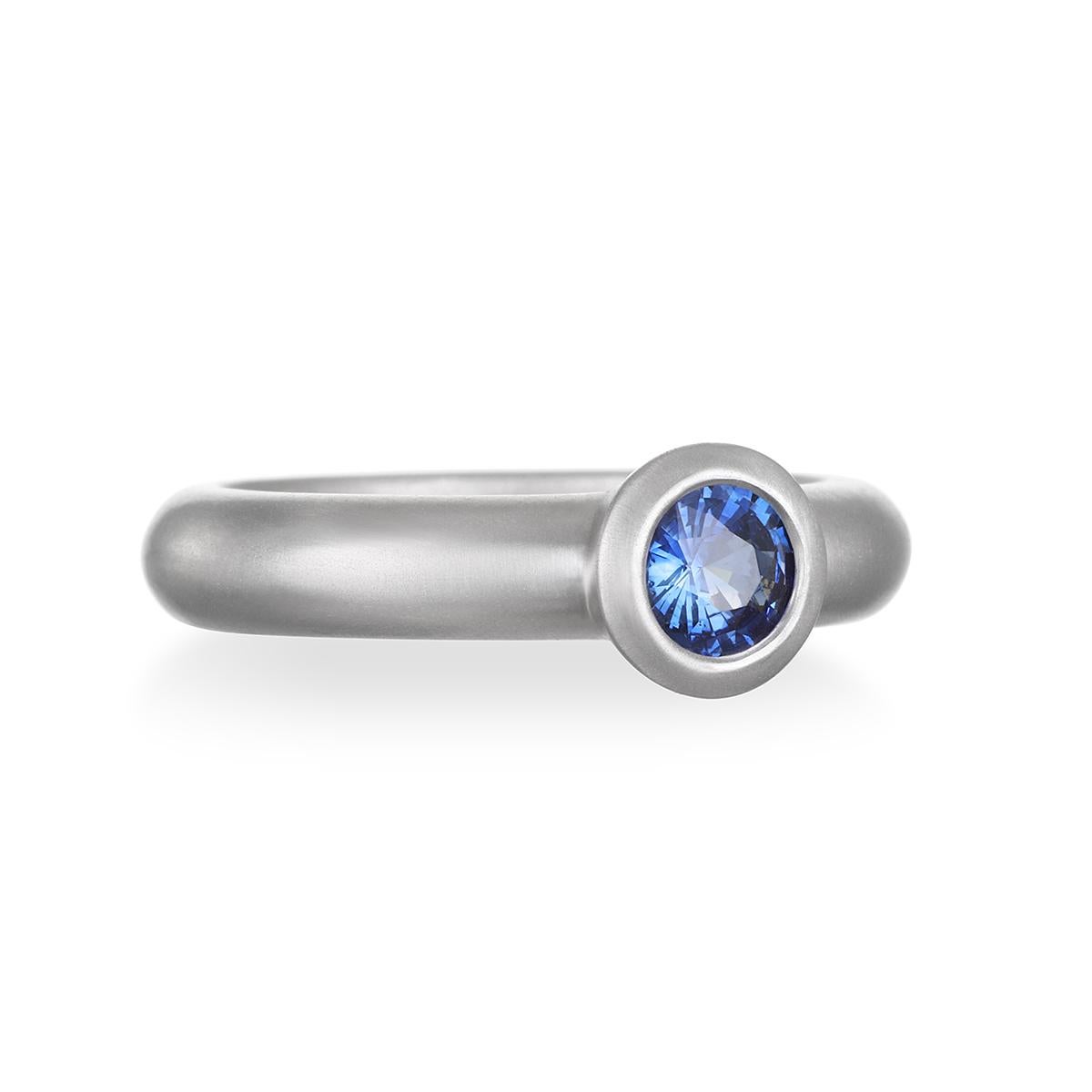 A beautiful, vivid shade of blue, this Ceylon Blue Sapphire round bezel ring is bezel set in platinum with a matte finish for a clean, timeless look. It can be worn alone as a statement piece or stacked with other rings. 

Sapphire: .62 Carats
Bezel