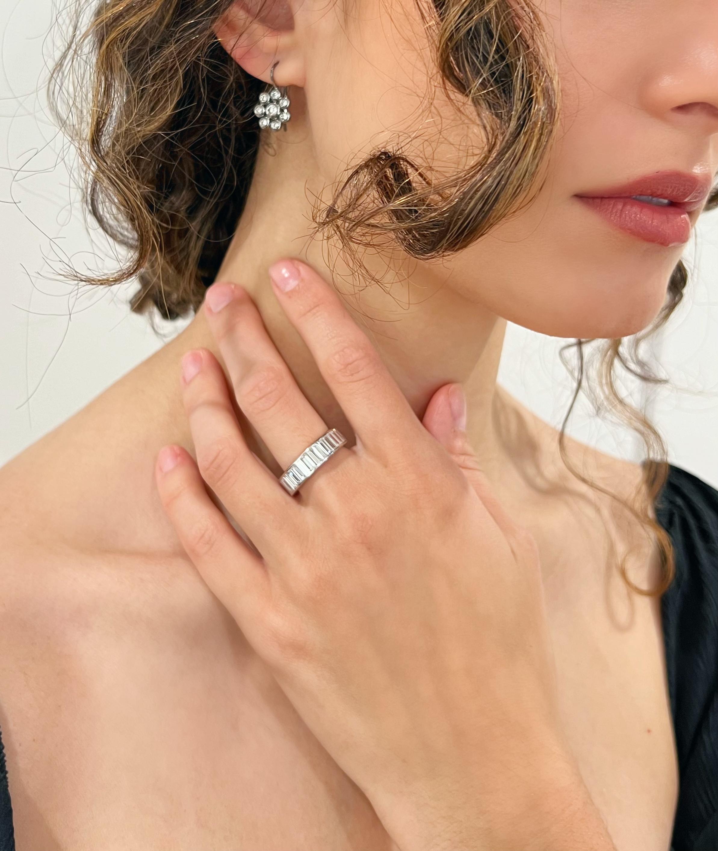 Faye Kim's Platinum Diamond Baguette ring has channel set baguette diamonds for a clean, sleek look. A perfect statement ring for the modern-day woman.

Diamonds 5.27 Carats twt
F/G Color
VS Clarity
Size 7, can be resized but may be priced