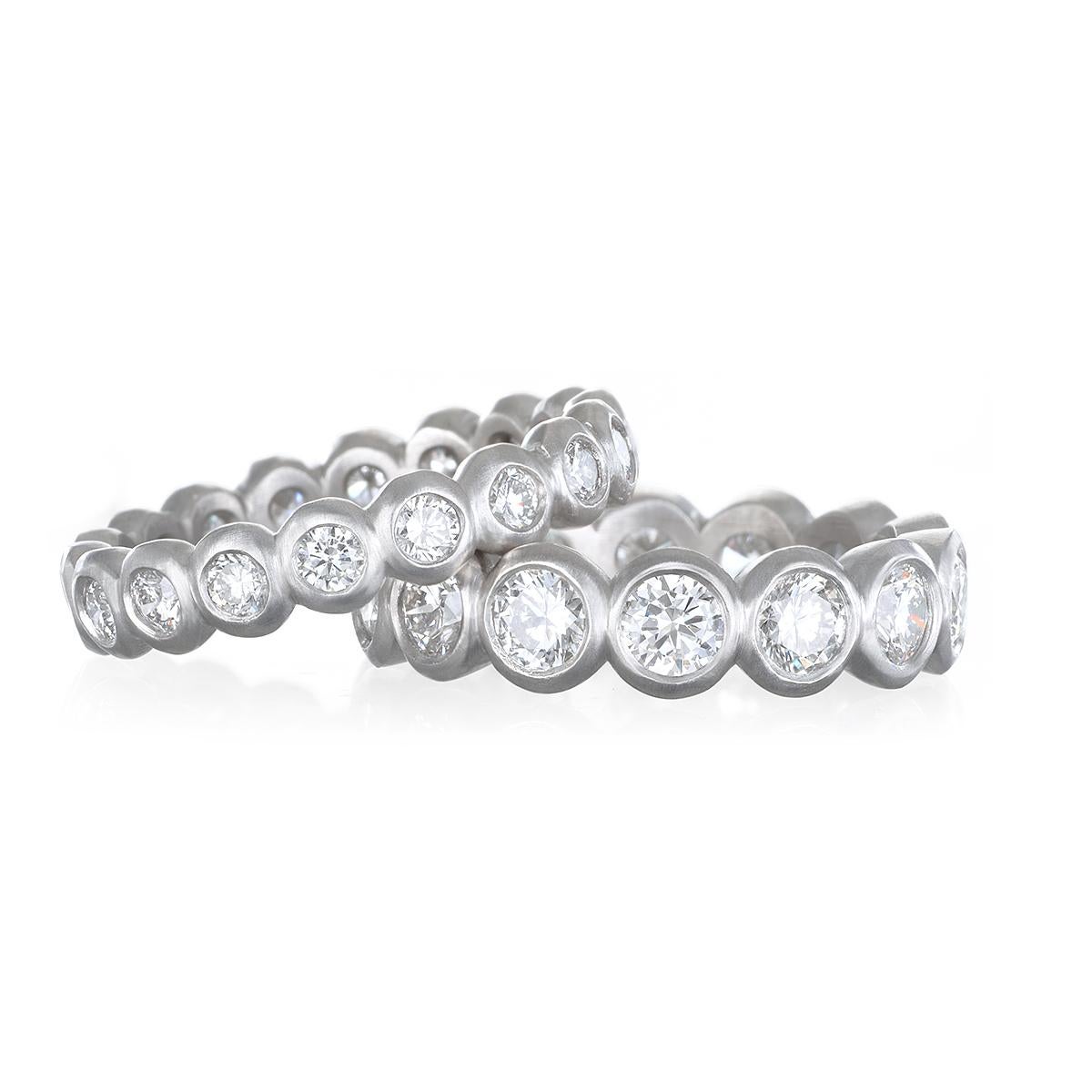 A classic beauty! Timeless and wearable, Faye Kim's Platinum Diamond Bezel Eternity ring is big, bold, and beautiful - the perfect band ring to wear alone or stack to create your own unique style.
Size 7.5
14 Diamonds  = 3.41 Carats Total Weight
F/G