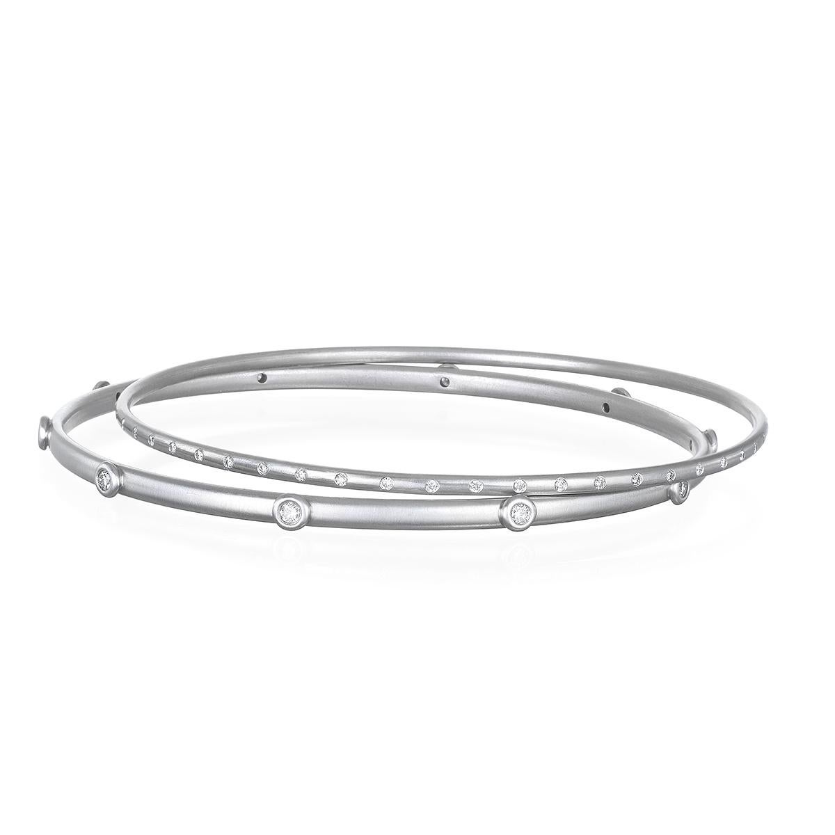 Handcrafted in platinum with diamond granulation bead detail, this diamond bangle is beautifully crafted with a sleek design. Wear alone or complete the look with a stack of bangles. Each sold individually.

Diamonds = .30 cts twt F/G Color, VS