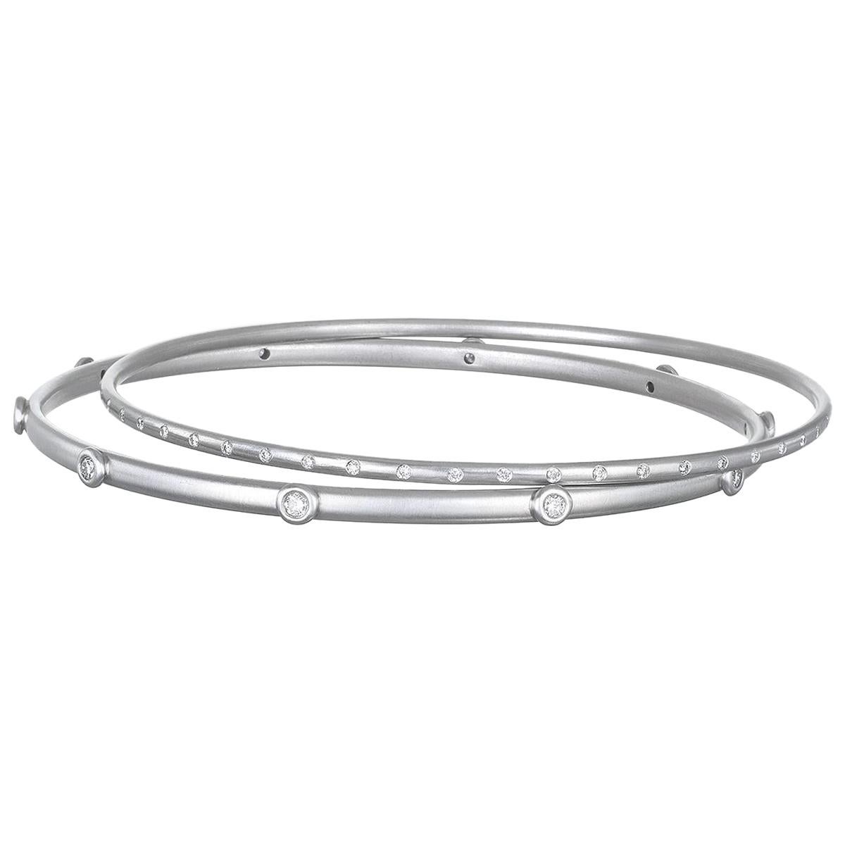 Handcrafted in platinum with delicate diamond detail, this gypsy set diamond bangle is beautifully sleek.
Wear alone or complete the look with a variety of shapes and textures. Each sold individually.

50 Diamonds = .4 cts twt
Inner diameter 2.5