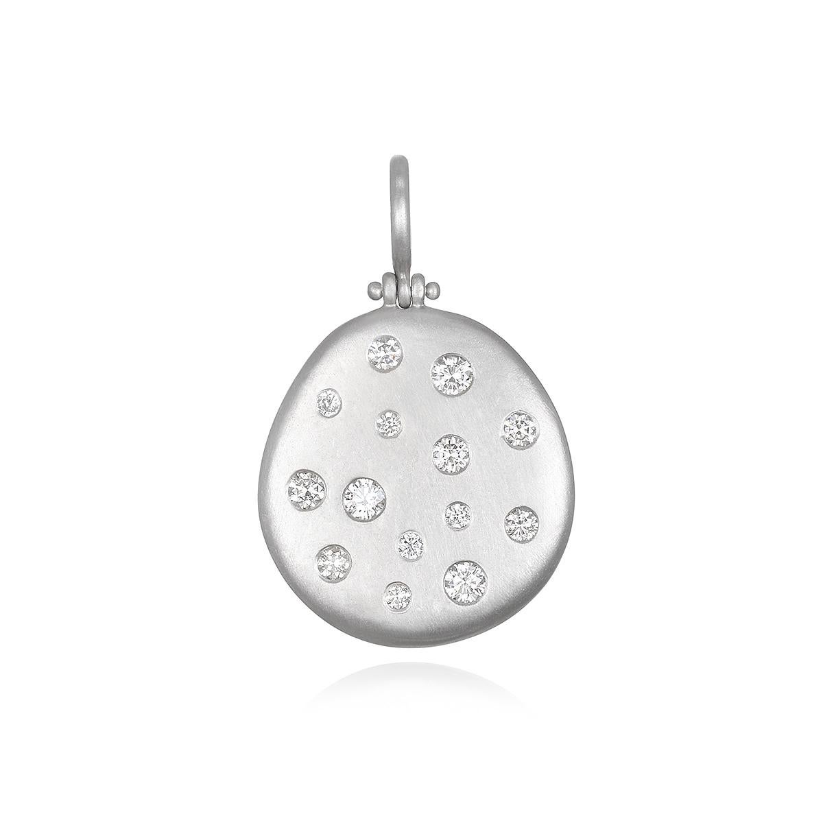 Versatile and easy to wear, Faye Kim's Platinum Diamond Hinged Dog Tag Necklace is perfect for every day. The pendant, which can be engraved and which shimmers and sparkles with its diamonds, is matte-finished in platinum and hangs on an 18 karat