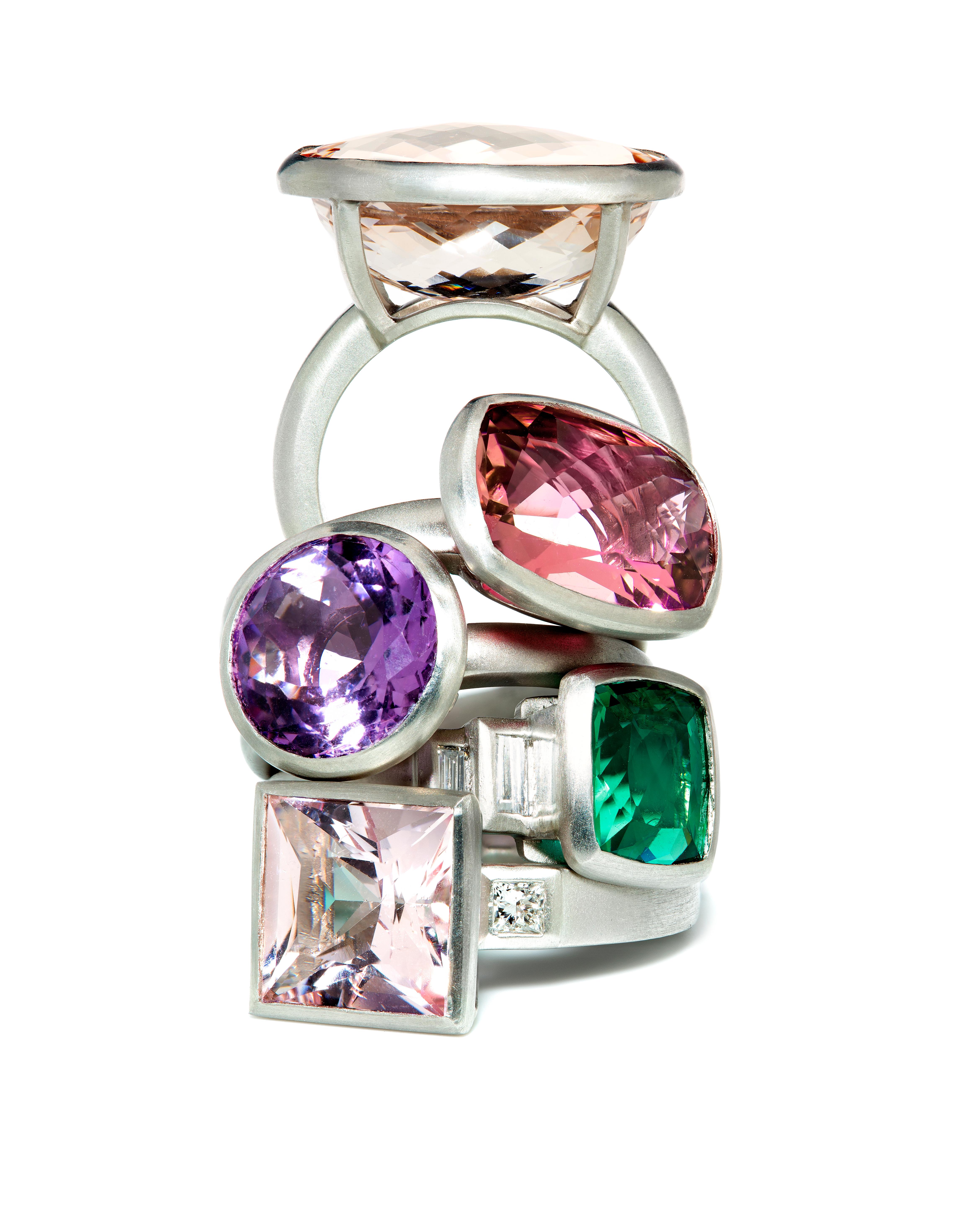 Rectangular Pink Tourmaline platinum ring with a matte finish.
Pretty in pink! The faceted antique cushion cut on this vibrant pink tourmaline pairs beautifully with its matte-finished platinum setting. Traditionally, pink tourmaline is linked to