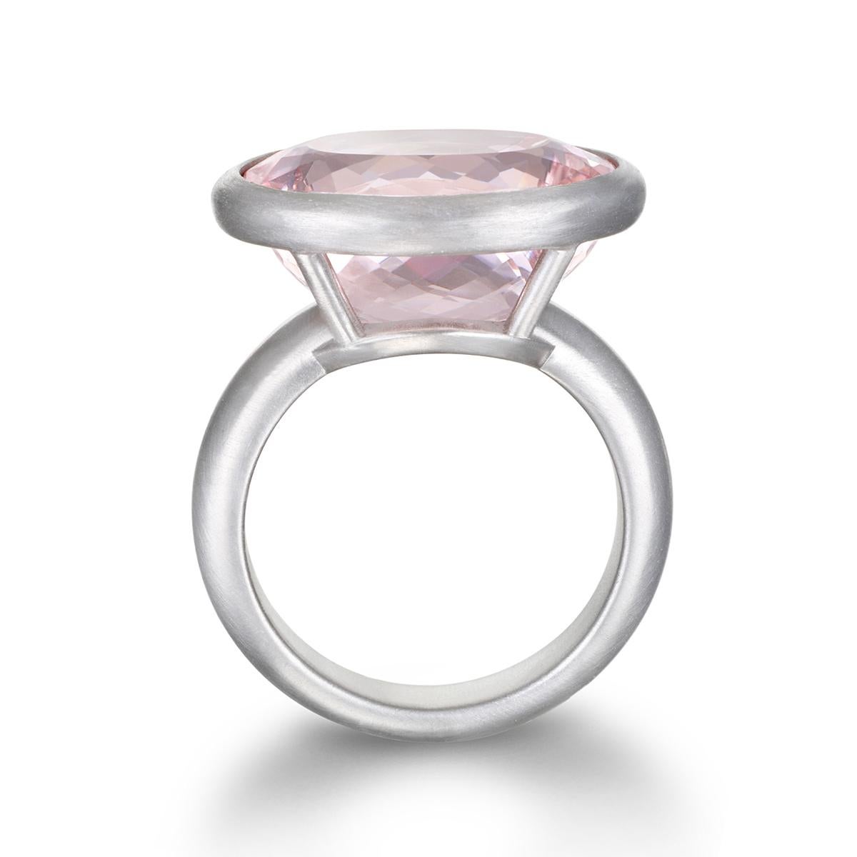 Faye Kim's Platinum Morganite Ring, with its spectacular open-bezel setting and matte finish, combines the delicate pink hue of morganite with a matte-finished platinum setting.

Morganite: 13.10 Carats
Size: 7, can be sized

Made in U.S.A.