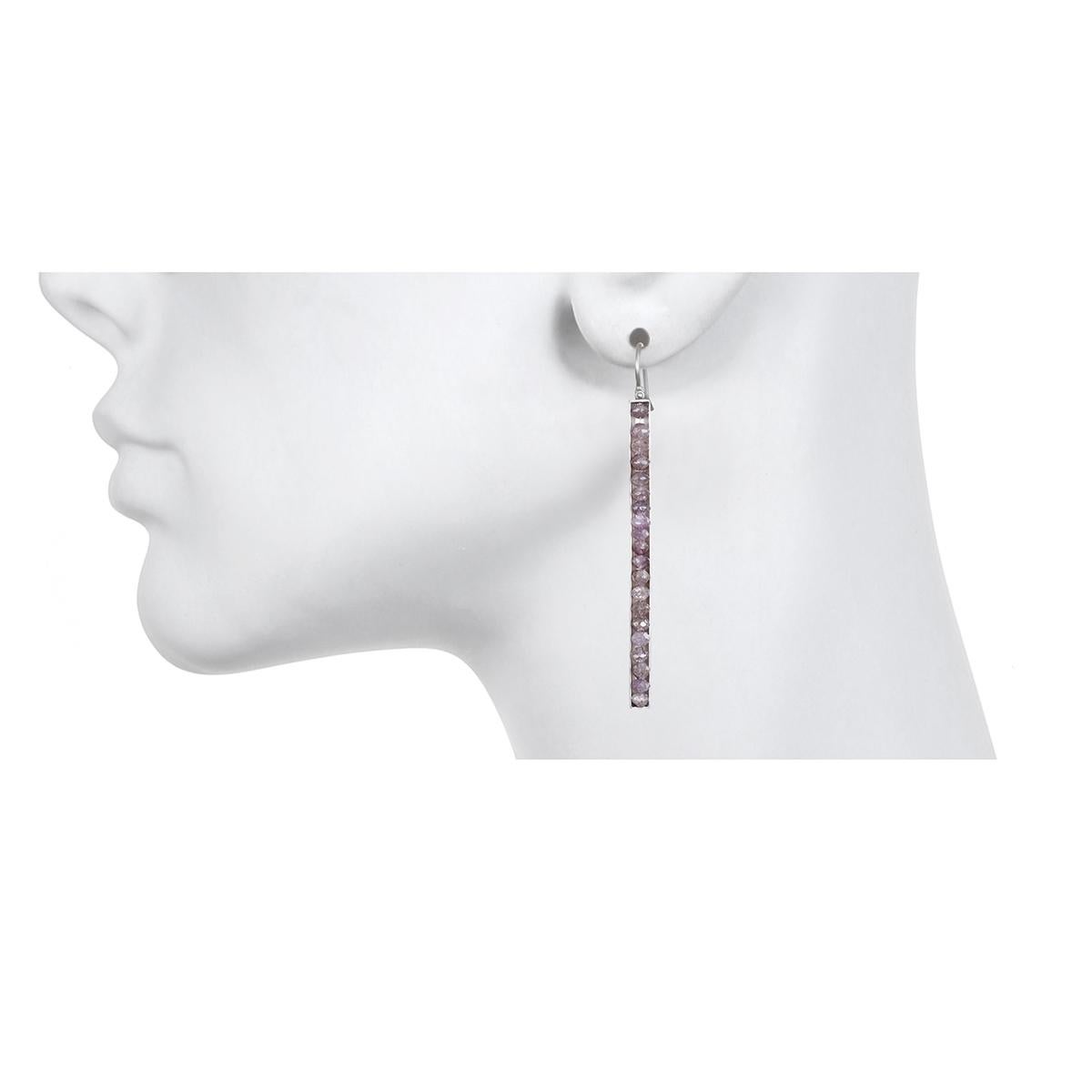 Feminine yet edgy, the matchstick style platinum earrings feature lavender faceted diamonds that are channel set for a clean, sleek look.  The hinge detail provides movement and sparkle. Matte-finished.
Diamonds: natural lavender color 7.41 Carats