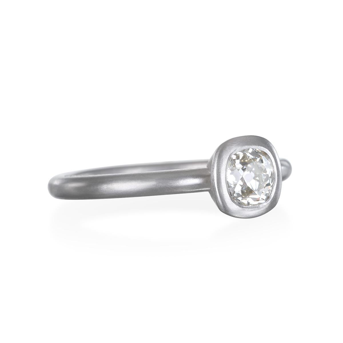 Offering classic yet contemporary appeal, this platinum ring, with its matte finish, is bezel set with an open gallery and can be easily stacked.
Mix and match to create your own style. 

Size 6.75 Ring can be sized.
Diamond: Old European Cushion