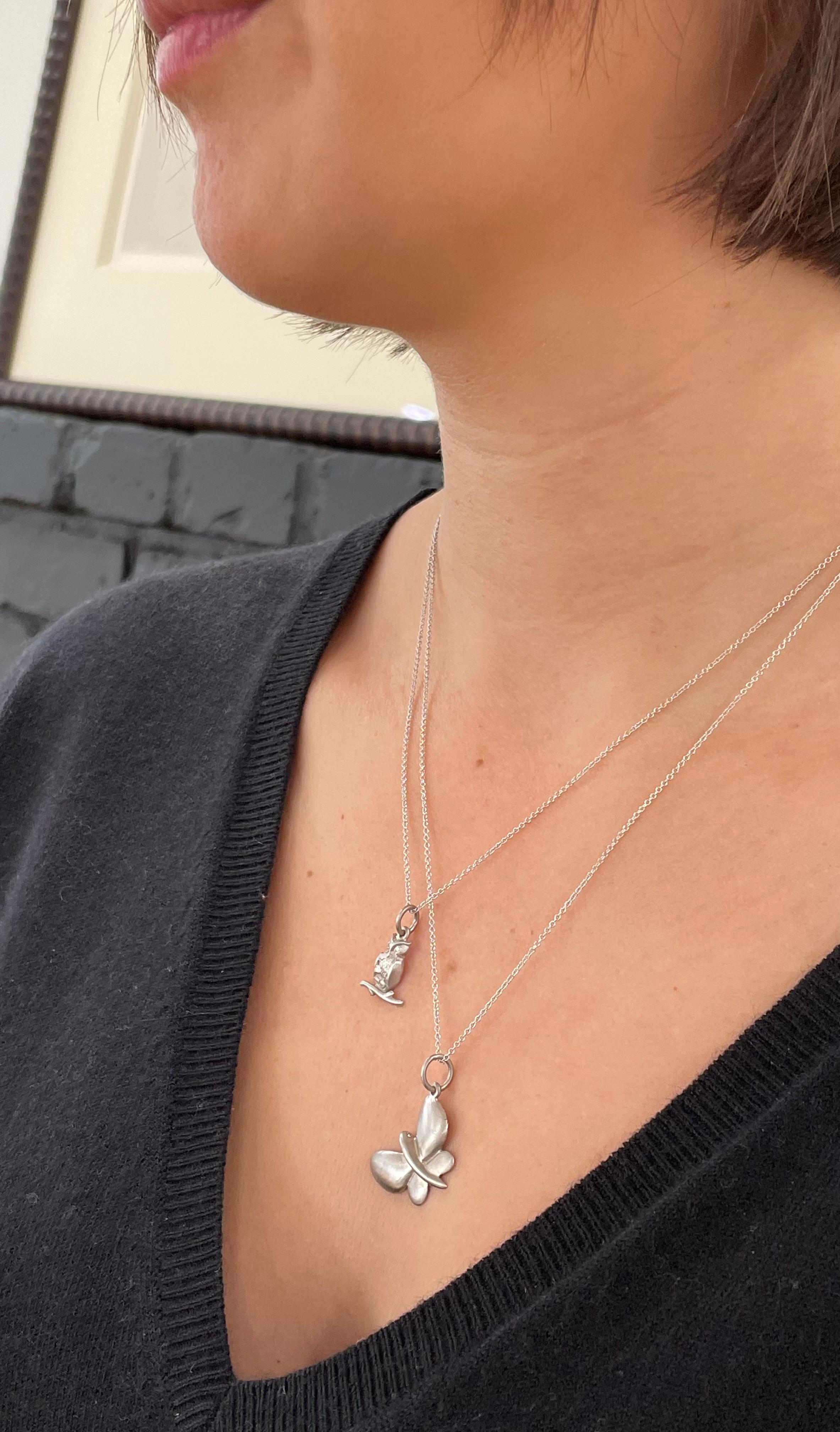 Symbolizing wisdom, truth, and knowledge, Faye Kim's truly charming Platinum Owl necklace is complete with diamond eyes.

Owl Length x Width: .6