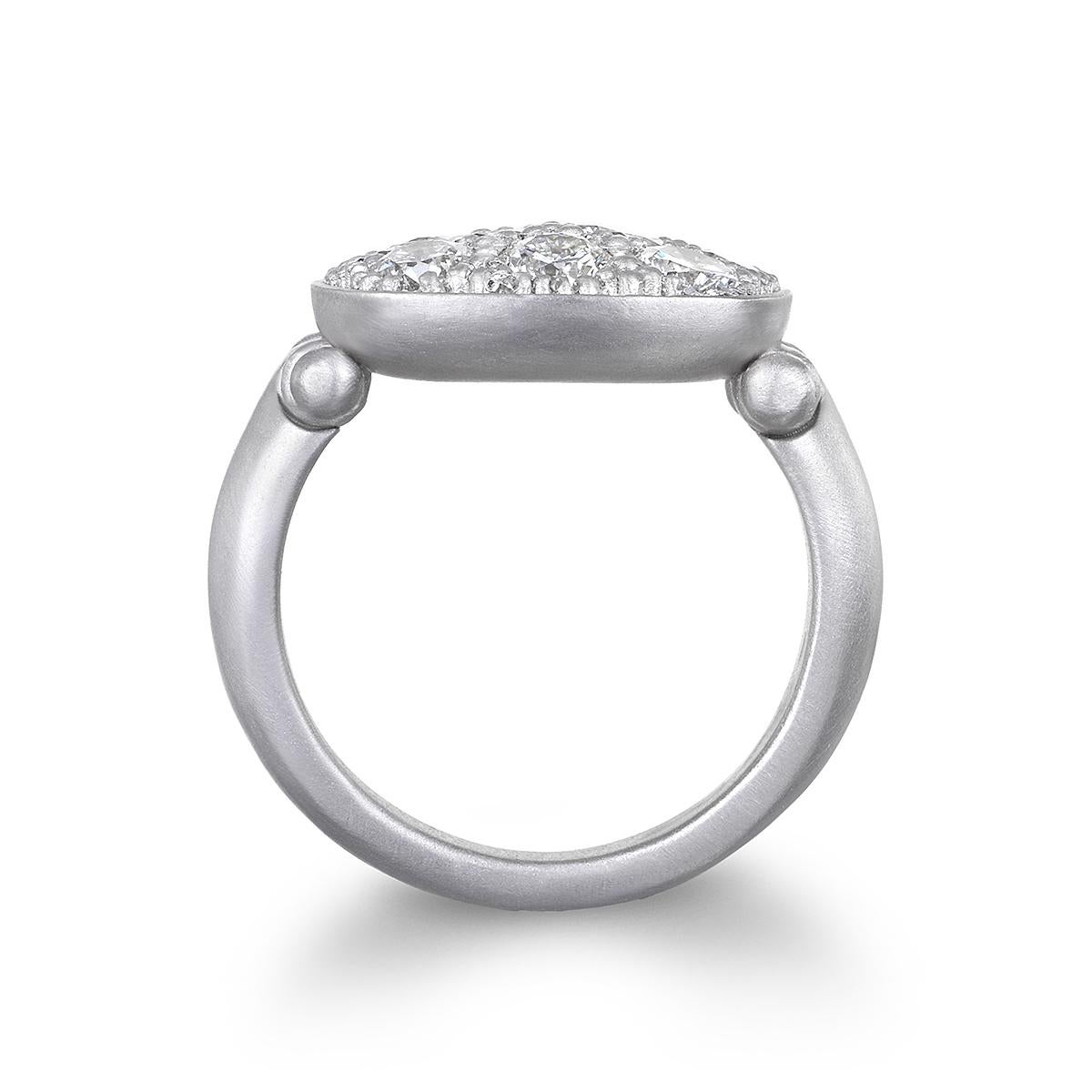 A modern-day take on the Signet Ring, Faye Kim's Platinum Diamond Hinged Chiclet Ring sparkles with bright, white pave diamonds. With its flattering chiclet or antique cushion shape, it's a great look worn on any finger and can be stacked with other