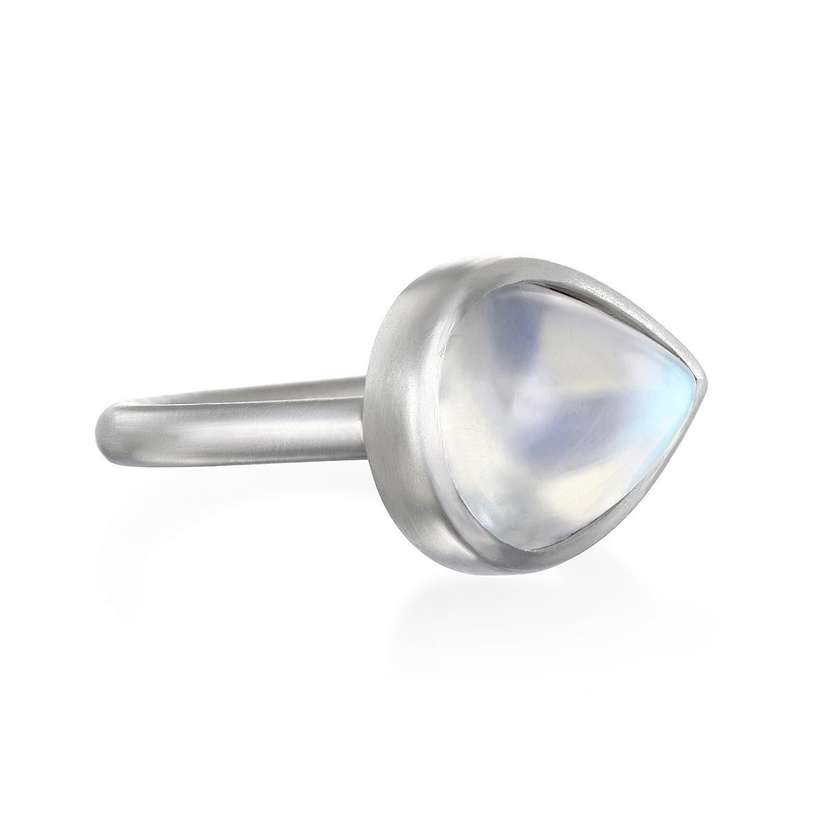 Considered to be a stone of inner growth and strength, this Ceylon Moonstone has been set by designer Faye Kim in platinum and reflects a bluish, milky light that has been compared to the light of the moon. The shape, polish, and matte platinum
