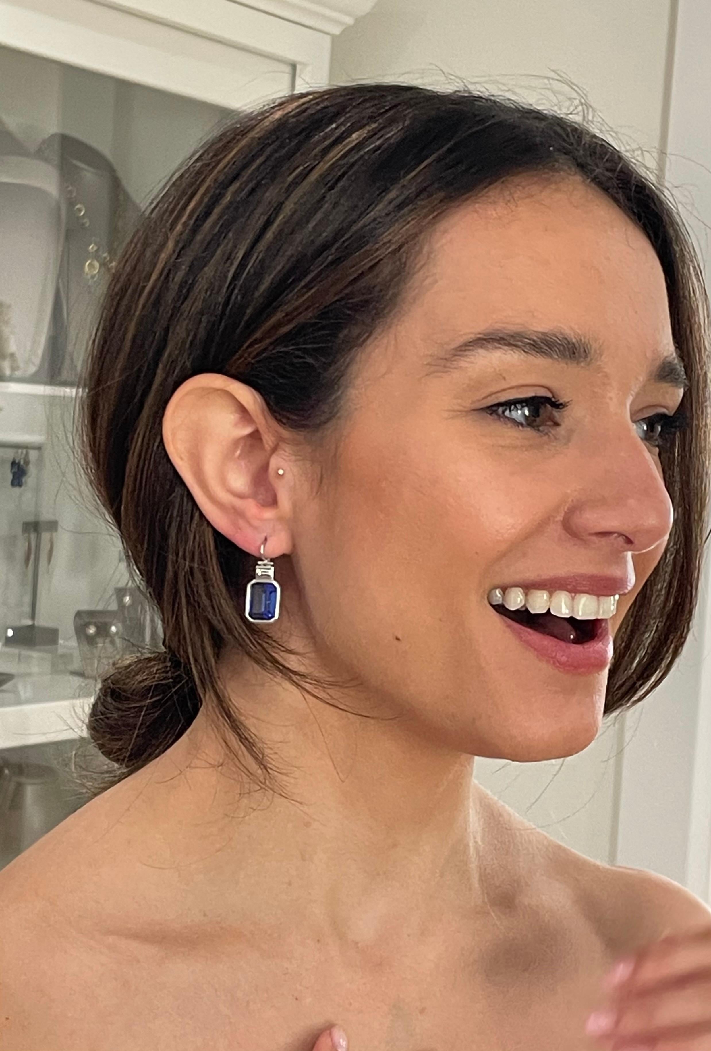 Faye Kim has set these spectacular tanzanites and diamonds  in platinum bezels to create a pair of show-stopping hinged drop earrings. The pair showcases the tanzanite's brilliant range of purple and blue hues, which are further enhanced by the