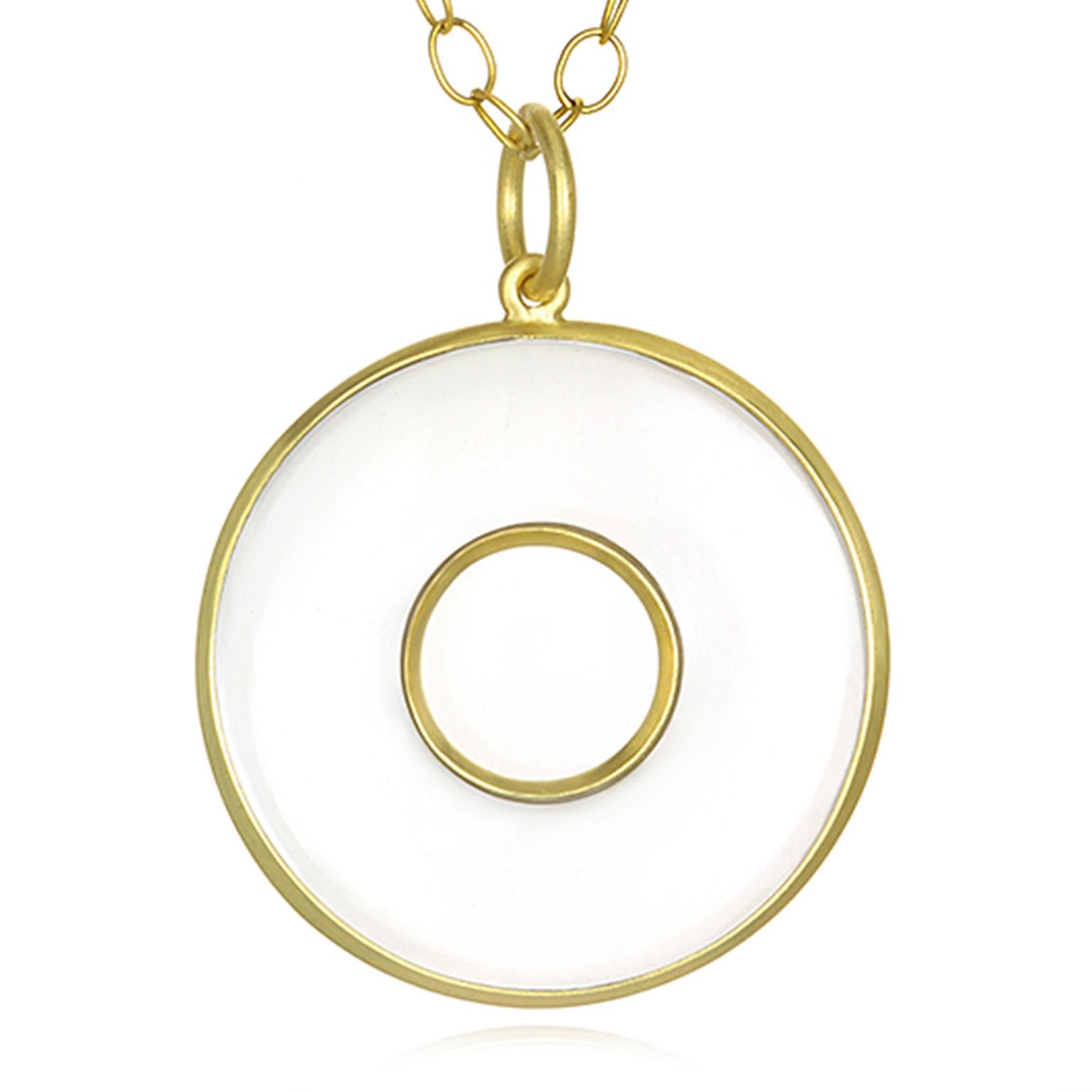 Faye Kim's Circle of Life pendant in Crystal Quartz is custom cut and hand-framed in 18k gold.  Known as the Master Healer, Rock Crystal Quartz is a natural clear gemstone believed to amplify energy as one of the most powerful healing stones. 