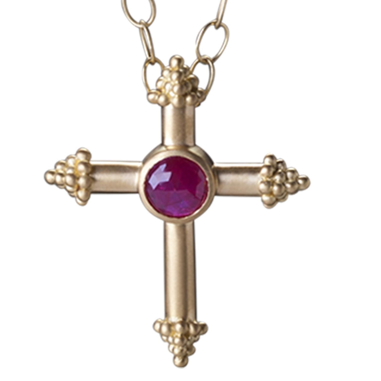 Handcrafted 18k gold granulation cross with faceted rose cut Ruby and granulation detail.  Hidden bail with hinge.  2.80 carats  1.25