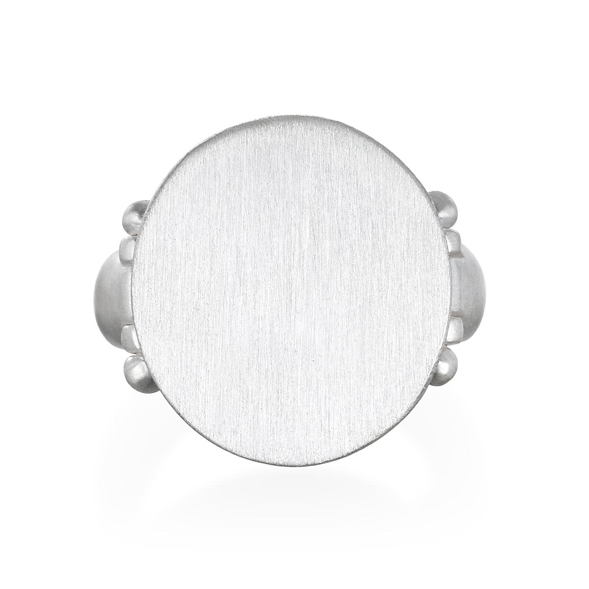 A variation of the traditional signet ring, Faye Kim's Sterling Silver Signet Ring is oversized and chunky in feel with her signature granulation hinge detail. Great worn your middle or index finger for a non-traditional style.

Sterling Silver,
